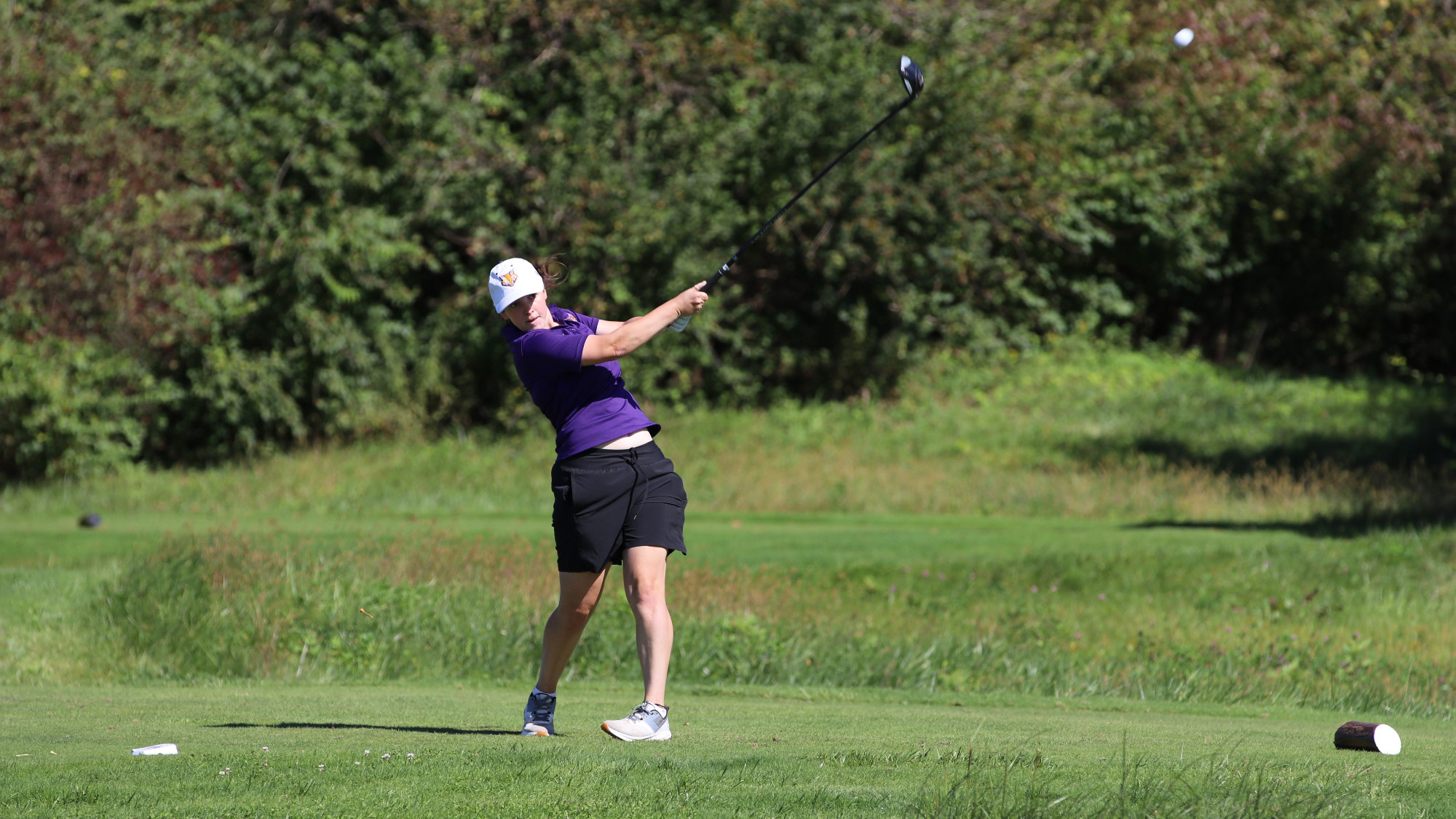  Ella Suchomel hitting a drive at the SLIAC Championships