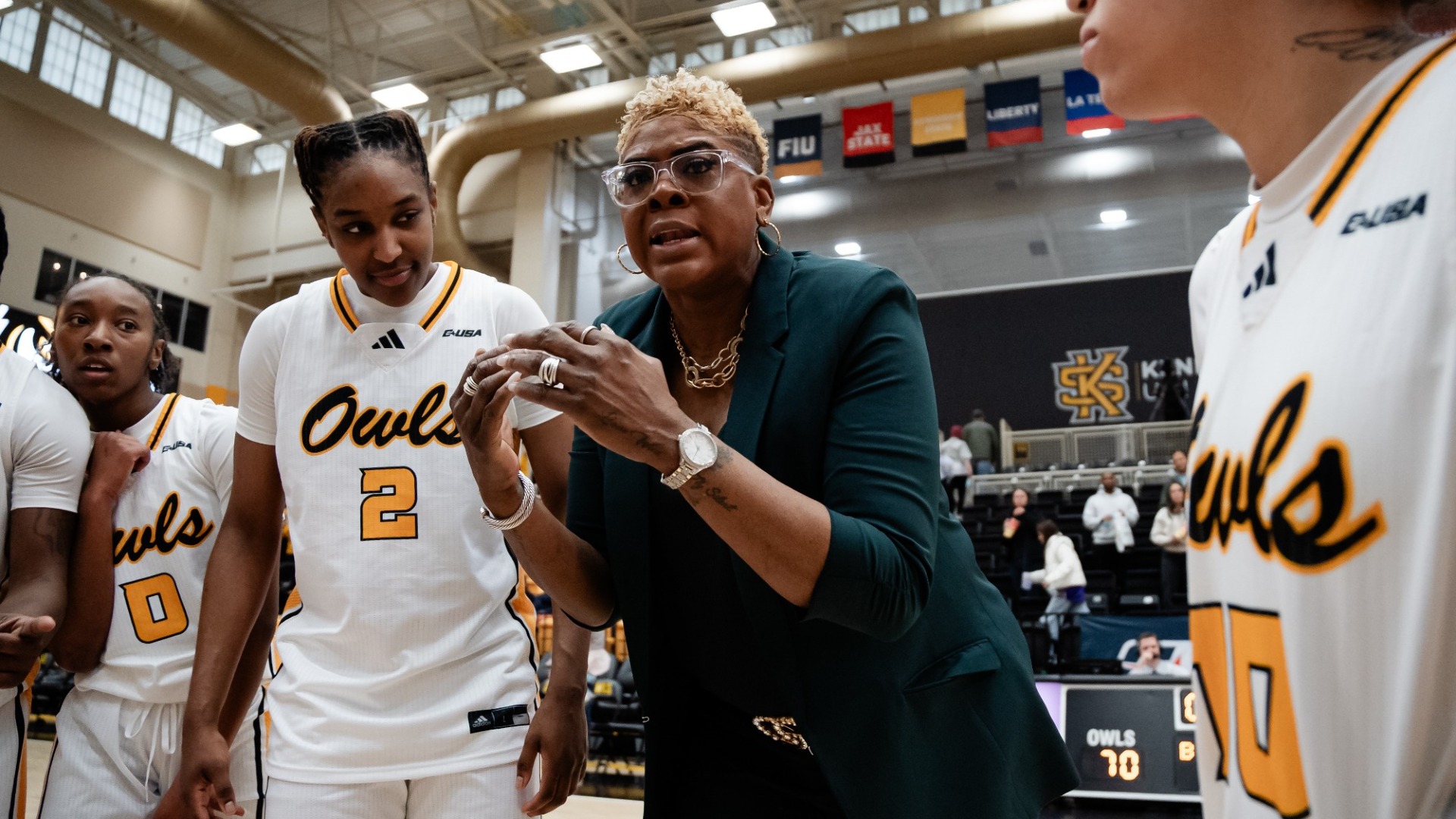Kennesaw State women's basketball head coach Octavia Blue in the team huddle.