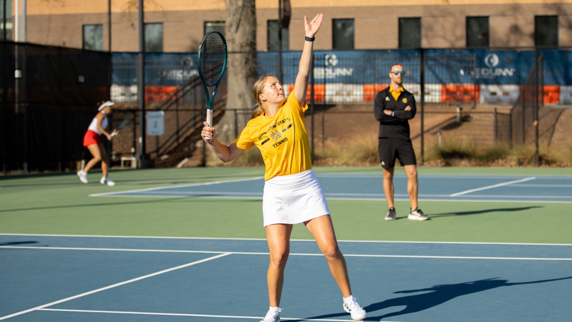 Kennesaw State women's tennis player Ema Baraniakova serves.