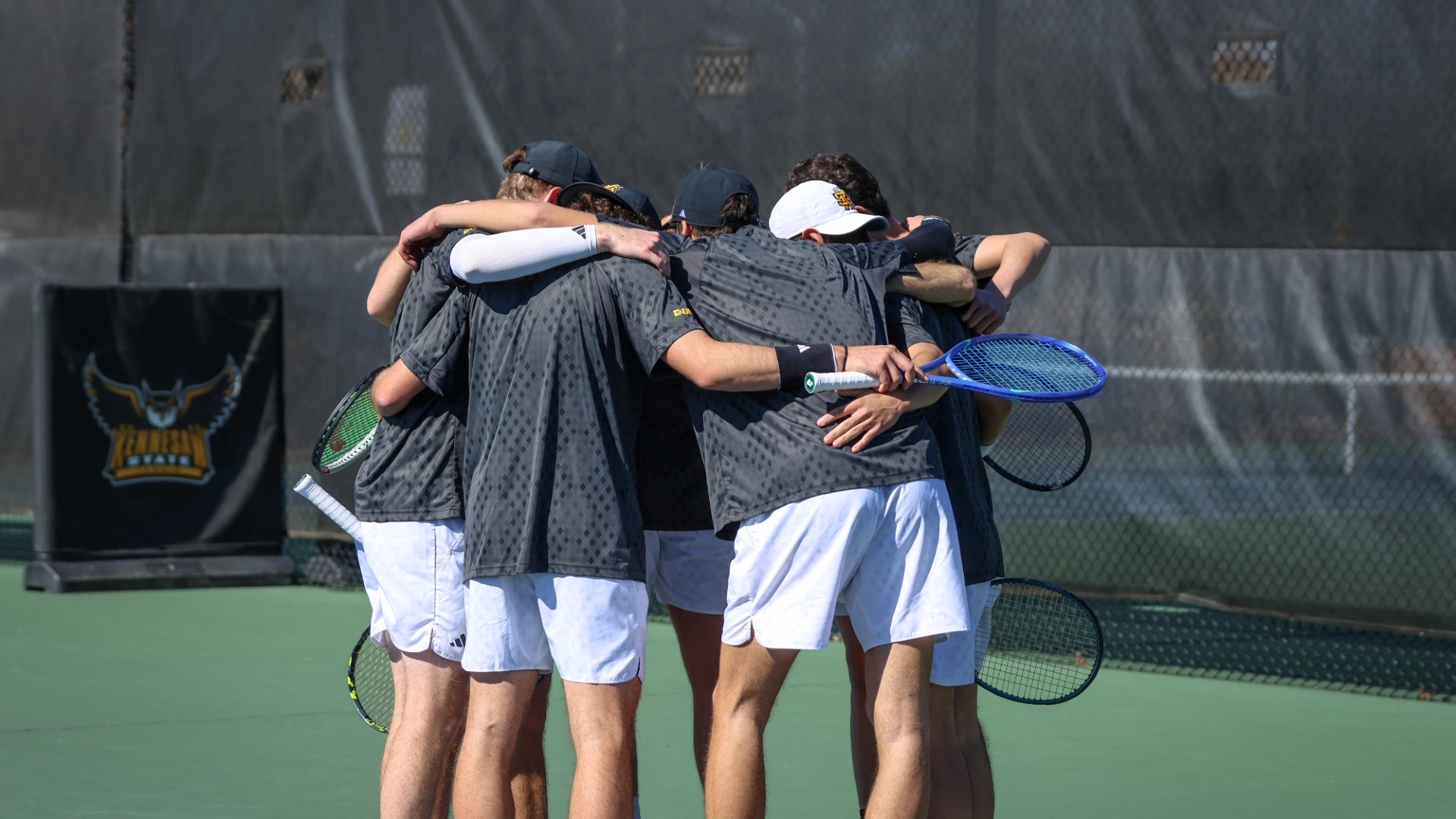Kennesaw State men's tennis huddles.