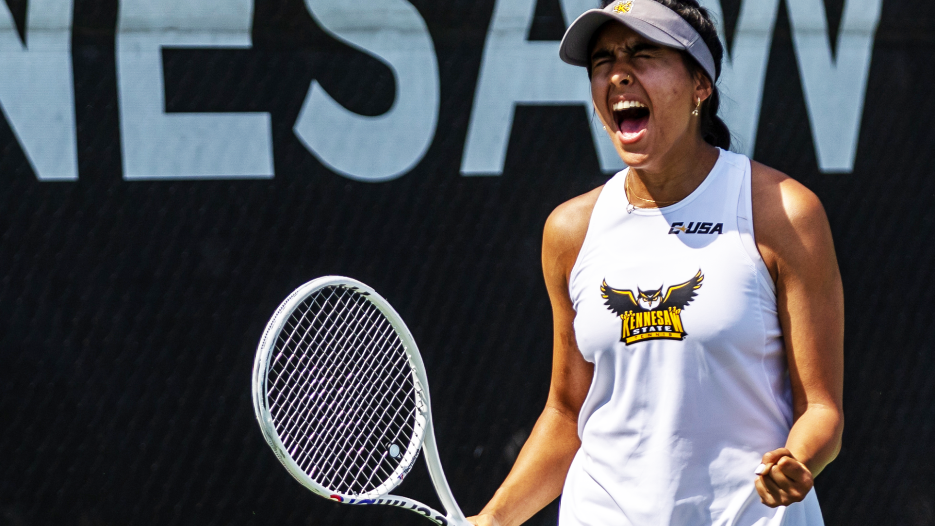 Kennesaw State women's tennis player Sofia Madrid celebrates versus Louisiana Tech.