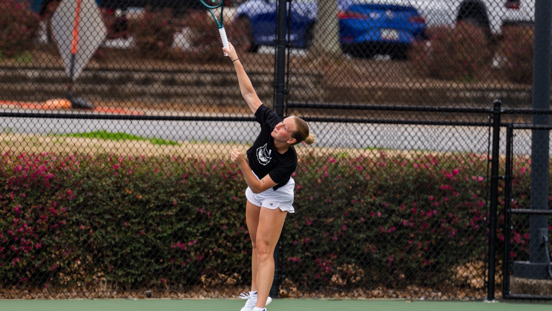 Kennesaw State women's tennis player Laura Nadaska serves versus Virginia Tech.