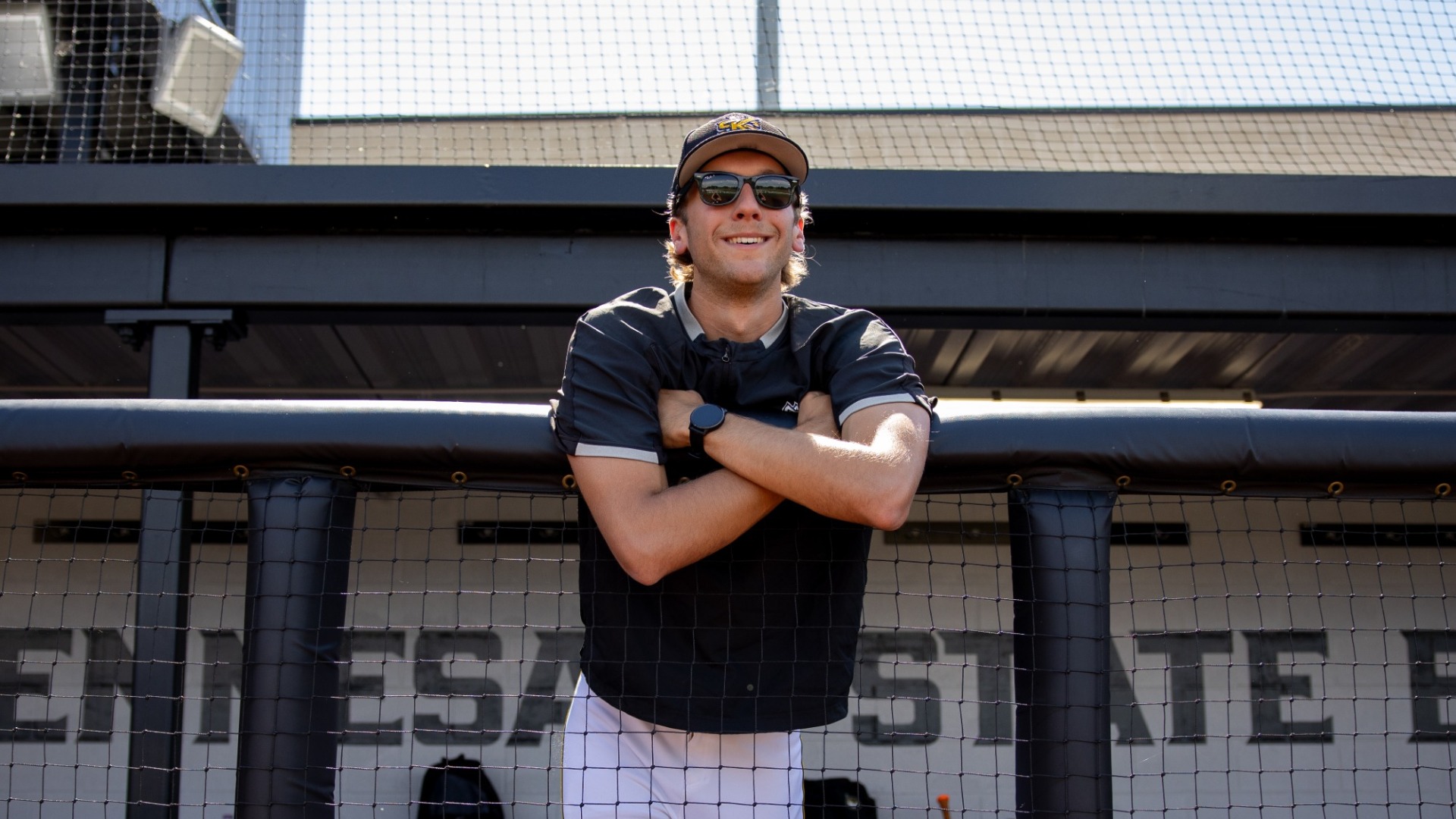 Jackson Abernathy standing in the dugout