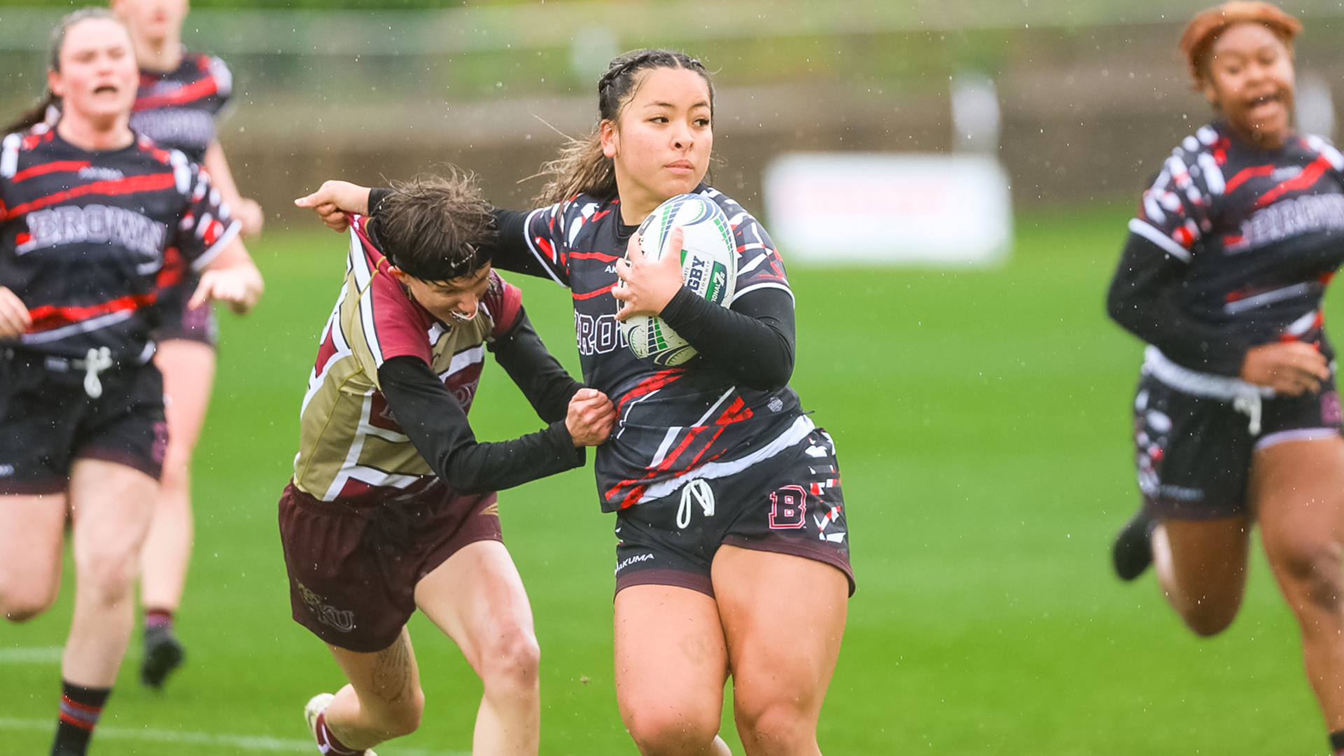 Kutztown women's rugby tries to make a tackle against Brown during a match at the Collegiate Rugby Championship in Boyds, Maryland, Friday, April 28, 2023.