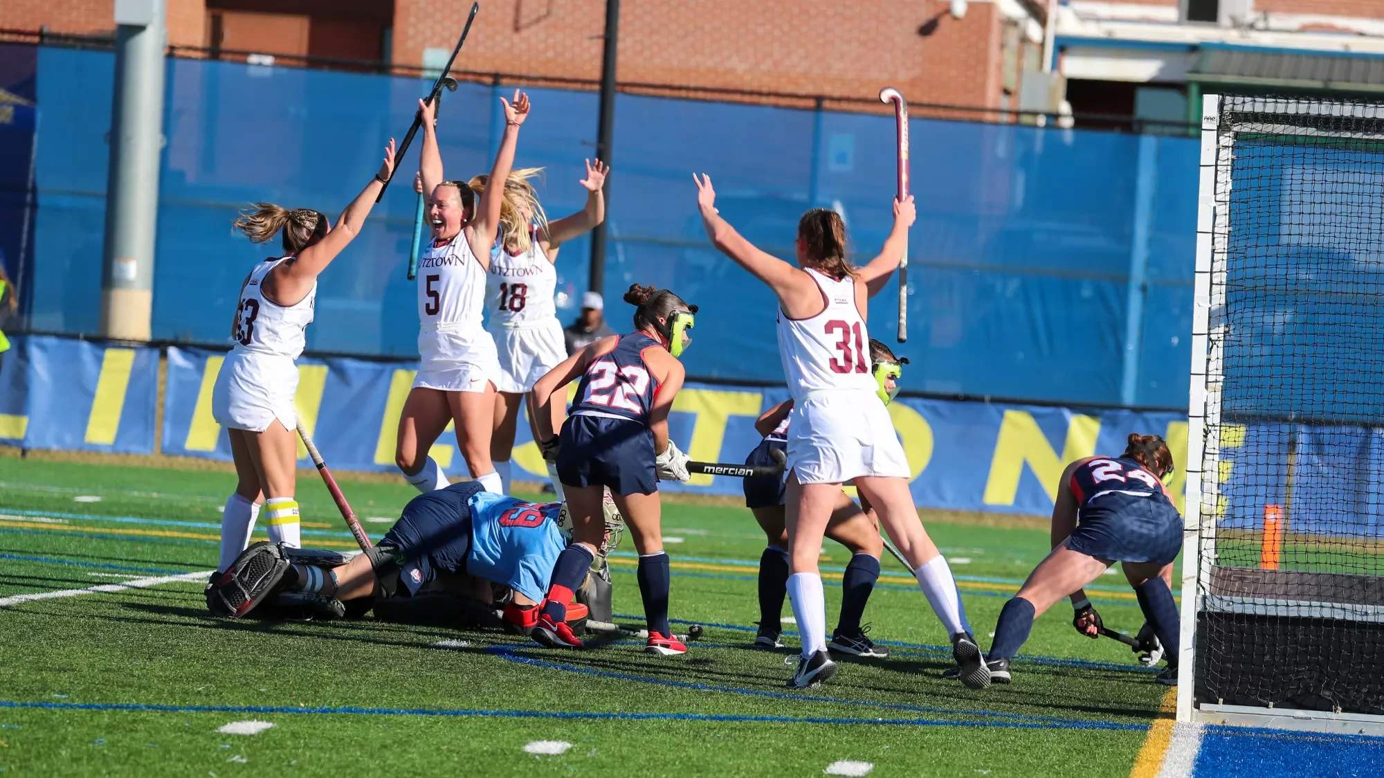 Erin Gonzalez (5) and her Golden Bear teammates celebrate Gonzalez's first of two goals during Kutztown's 4-3 win over Shippensburg in the NCAA semifinals on Friday, Nov. 22, 2024.