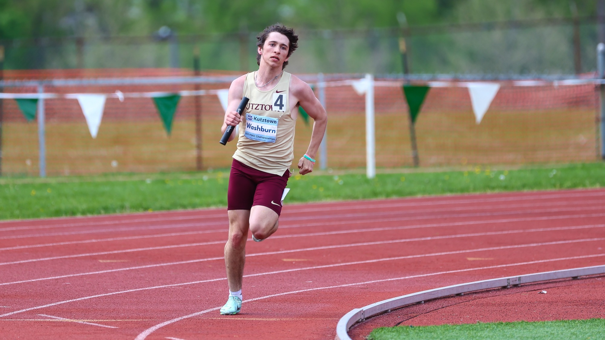 James Washburn running a relay event at 2023 PSAC Outdoor Championships