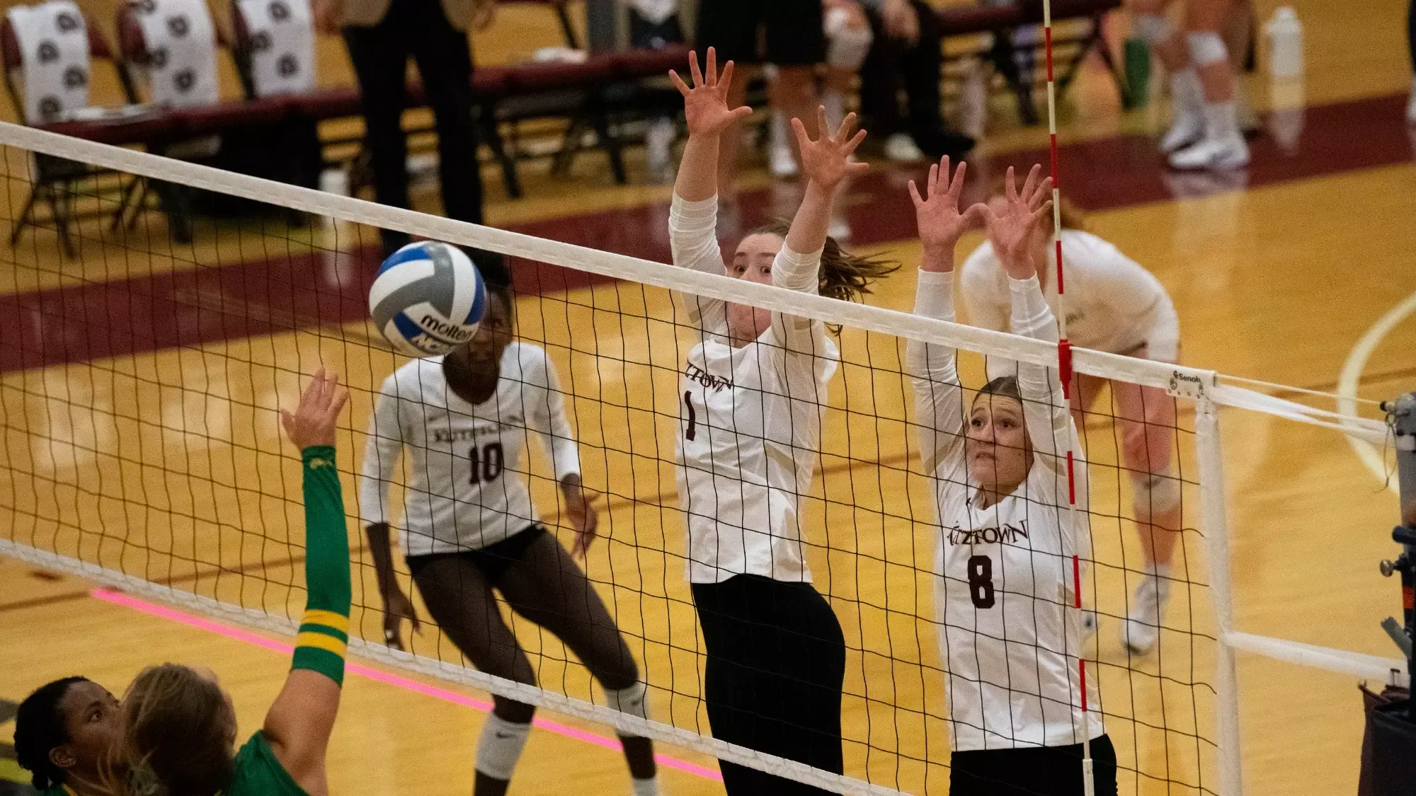 Kutztown going up for a block vs Felician 101325