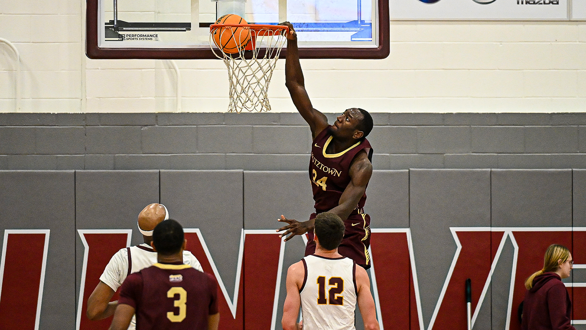 Jordan Nkoa Abessolo of the Kutztown University men's basketball team dunks the ball for two of his team-high 14 points in a PSAC crossover game at No. 15 Gannon on Tuesday, Dec. 16, 2025.
