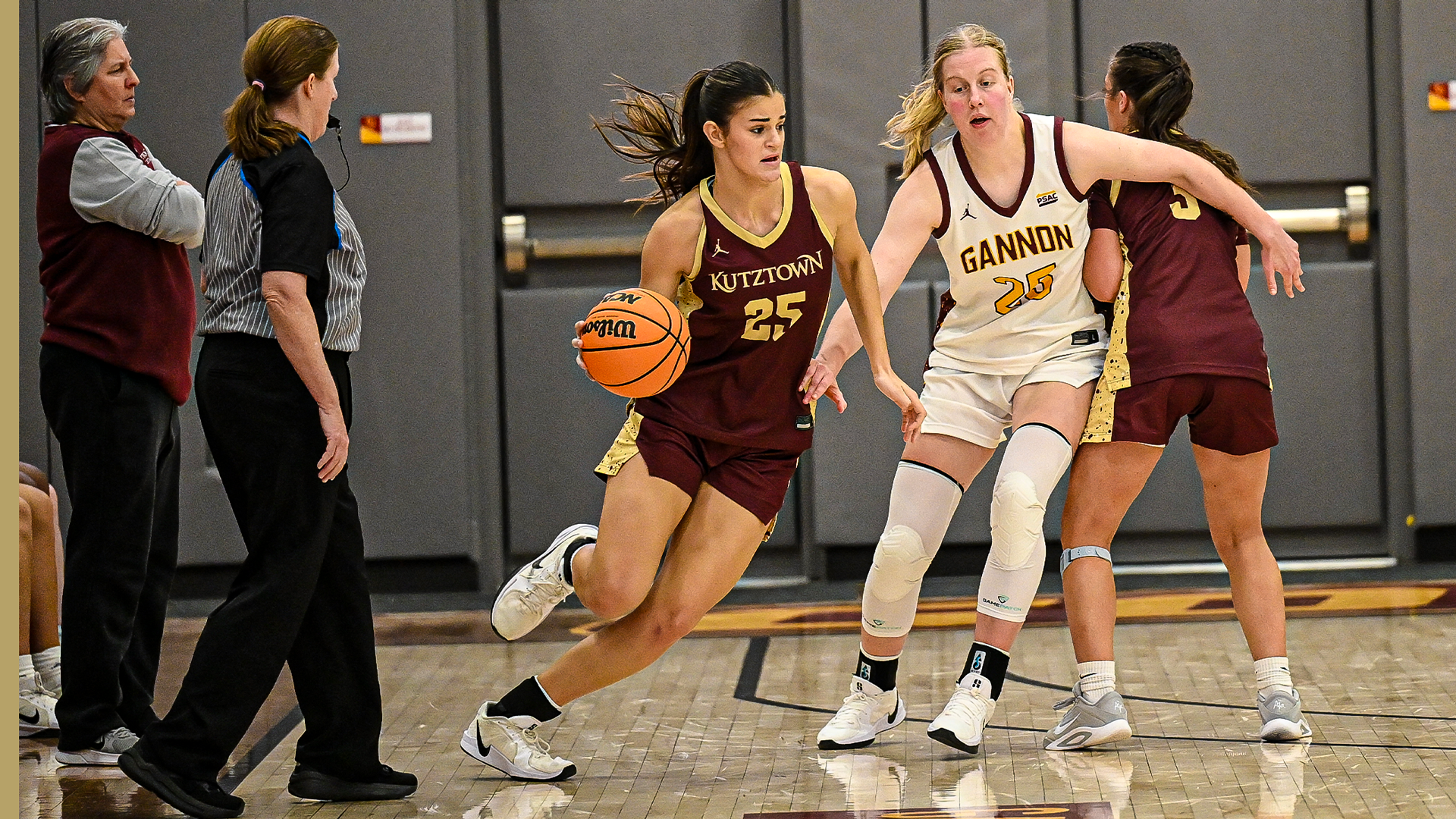 Ariana Smuda of the Kutztown University women's basketball team dribbles around a Gannon defender in a PSAC game on Tuesday, Dec. 16, 2025.