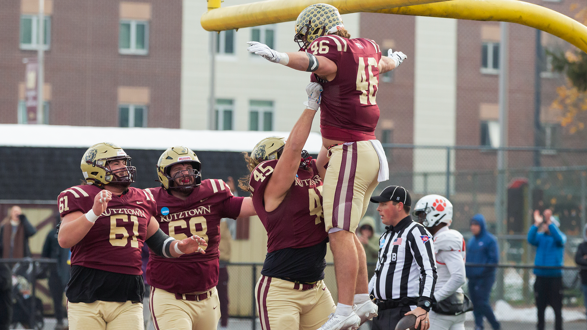 Kutztown University tight end Luke Maxwell (46) celebrates one of his three touchdowns with teammates Gino Campagna (45), CJ Conti (61) and Adam Conklin (68) during the No. 3 Golden Bears' 52-29 victory over No. 24 Frostburg State in the NCAA DII quarterfinals on Saturday, Dec. 6, 2025. 