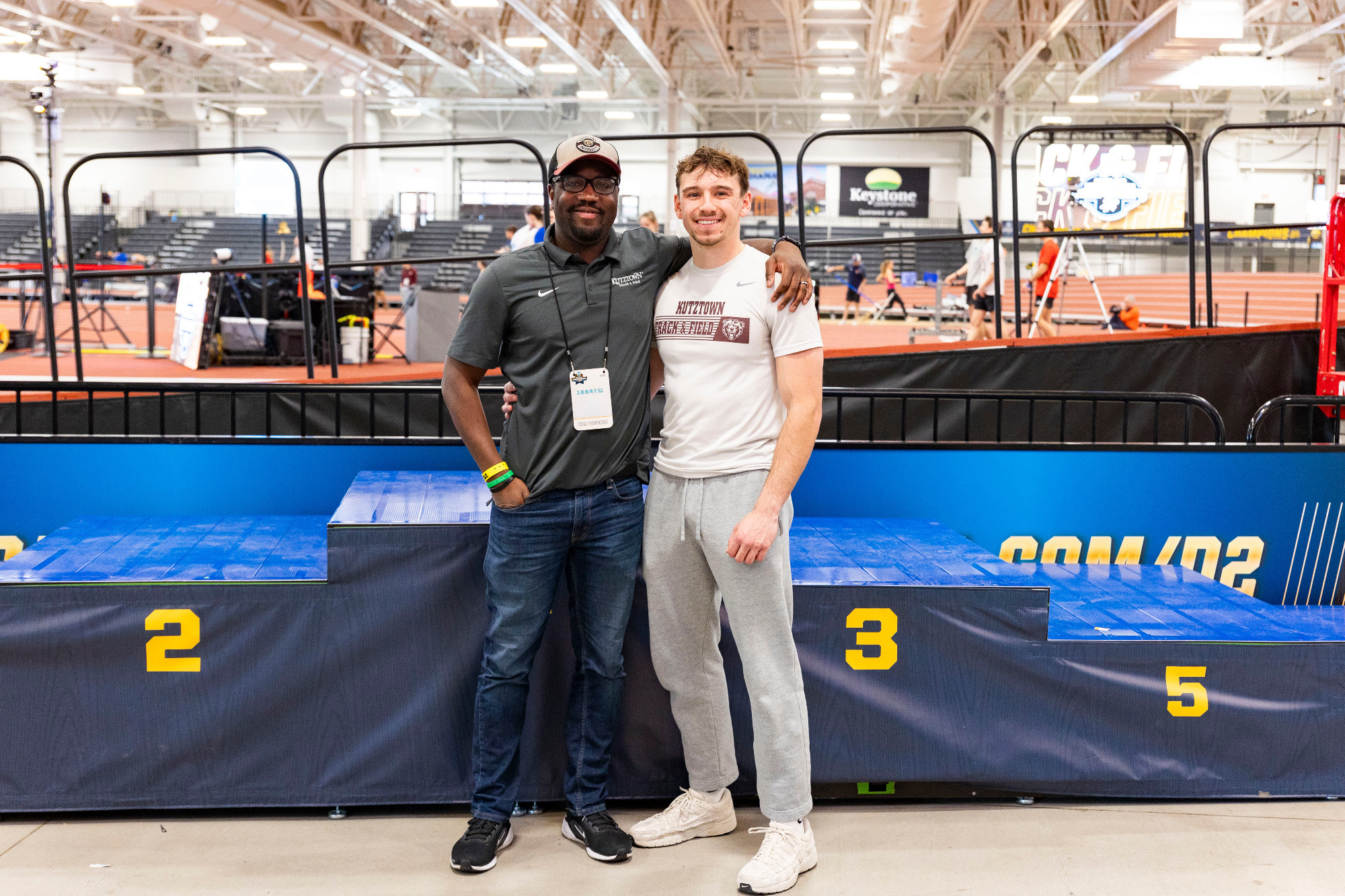 Sprinter Michael Fellin and assistant coach James Alaka pose for a photo prior to the 2025 NCAA DII Indoor Track & Field Championships on Wednesday, March 12, 2025.