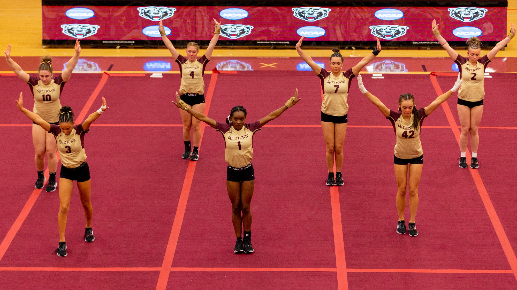The Kutztown University acrobatics & tumbling team completes a routine in a meet against Stevenson on February 27, 2025.