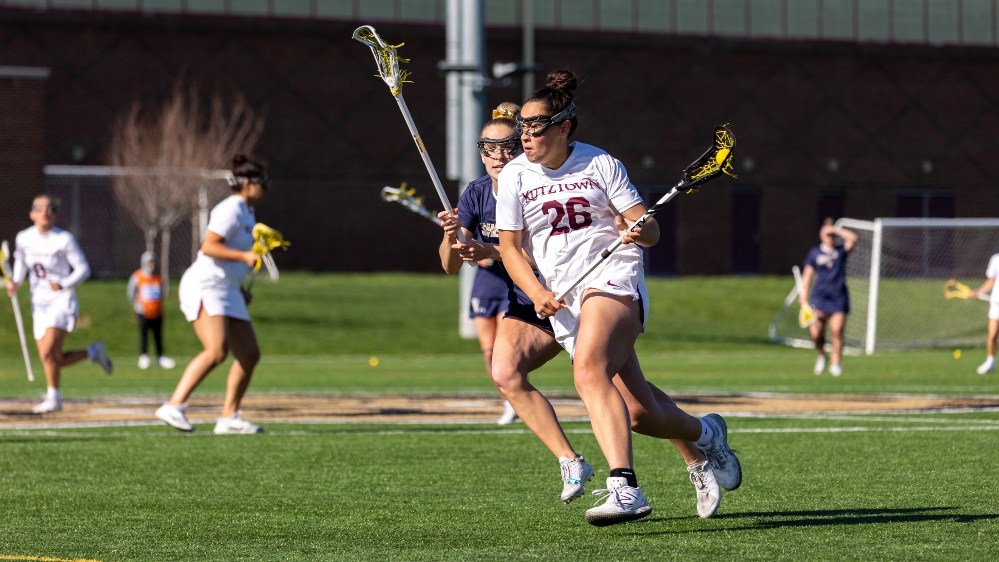Lailah carries the ball down the field vs Shepherd at home in dominating PSAC East win
