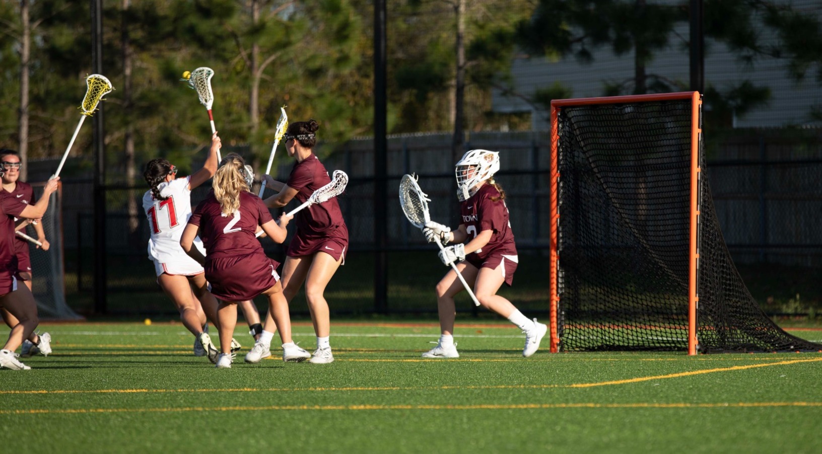 Flager attacker defended by Davis and Brooks, shoots the ball towards Bragg