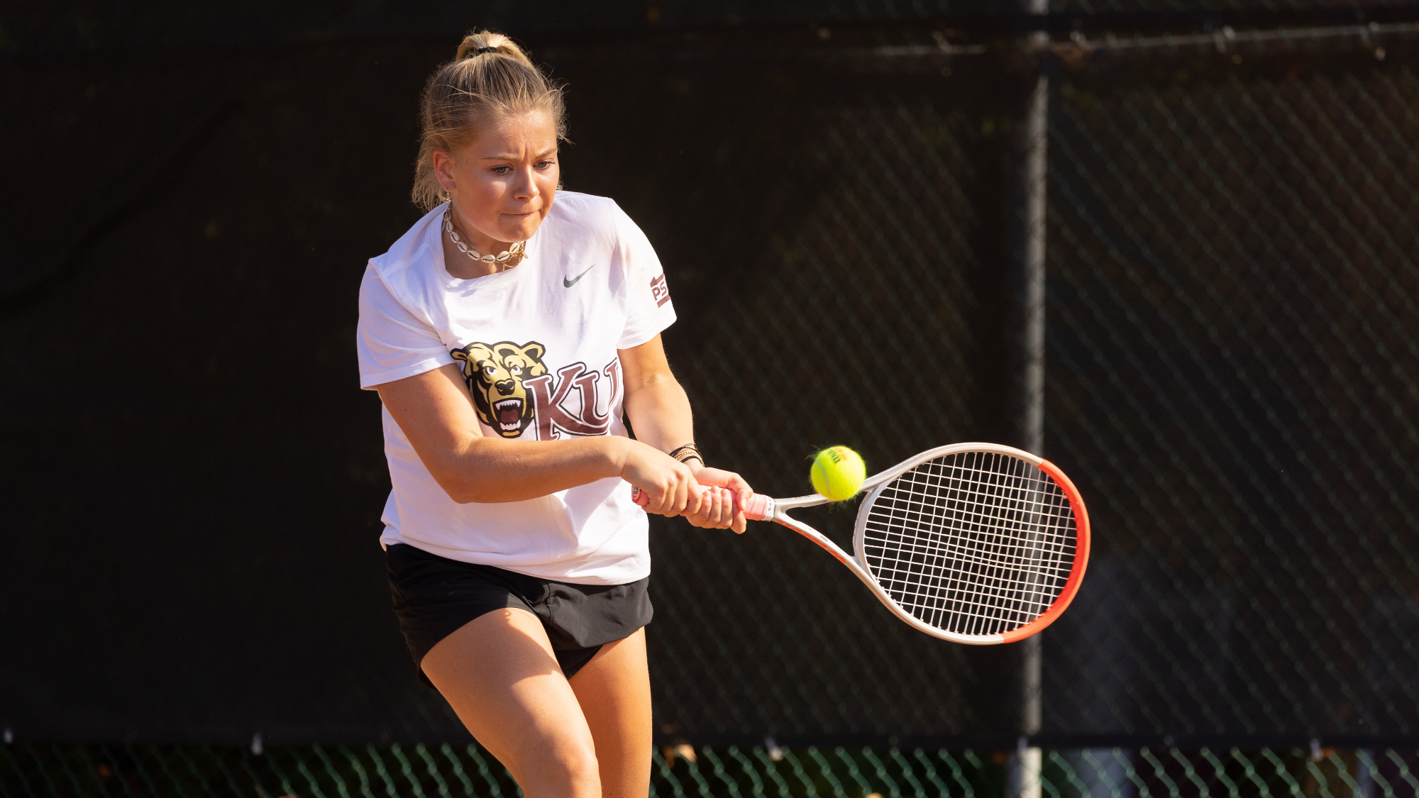 Kutztown University women's tennis player Bieke Roovers hits a backhand shot during a non-conference match against Daemen on Oct. 14, 2024.