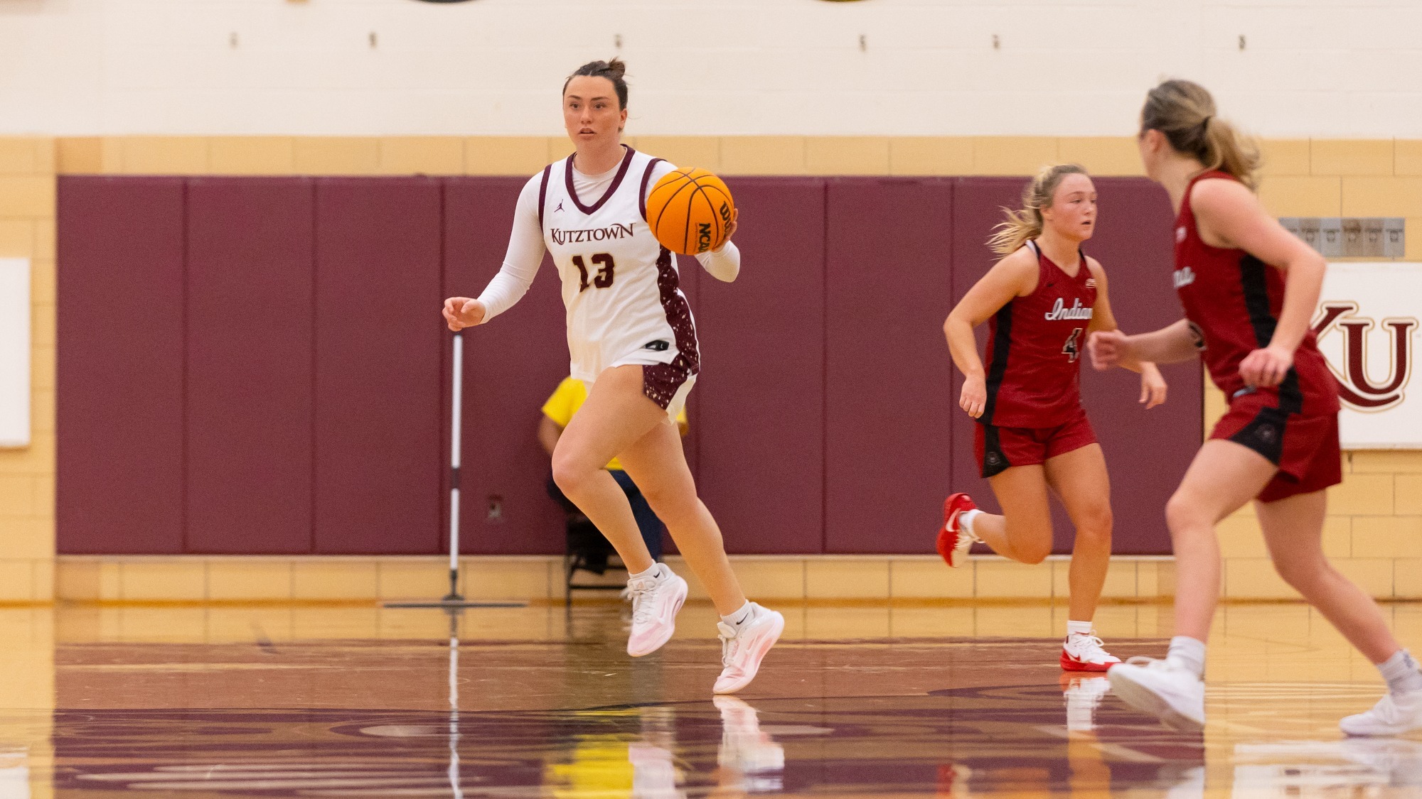 Taylor Gurysh dribbling the ball up the court vs. IUP, 12/5/25