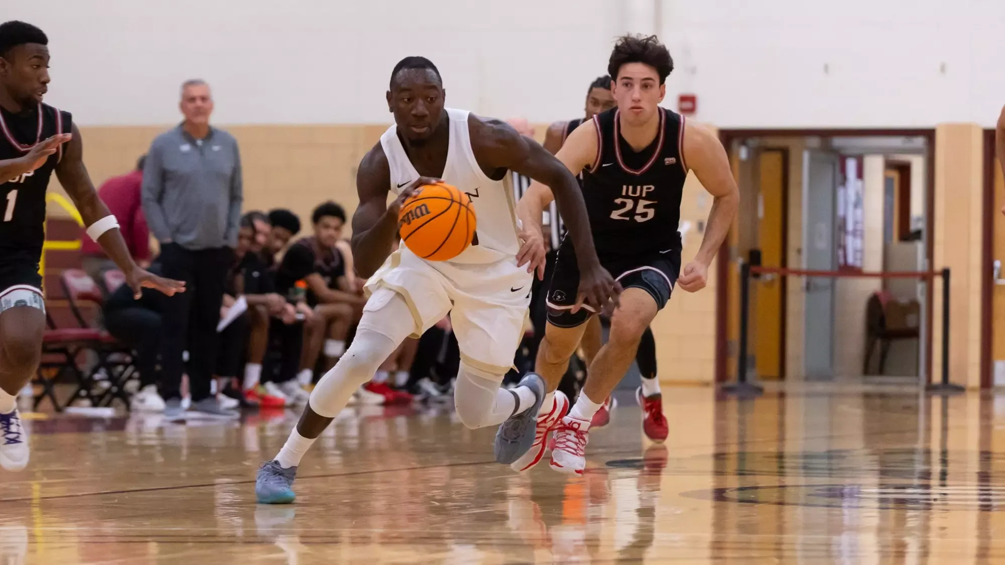 Jordan Nkoa Abessolo dribbling down the floor vs. IUP 12-5-25