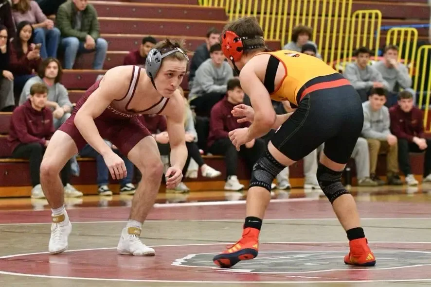 Nic Allison facing off with an opponent against Seton Hill 12-5-25