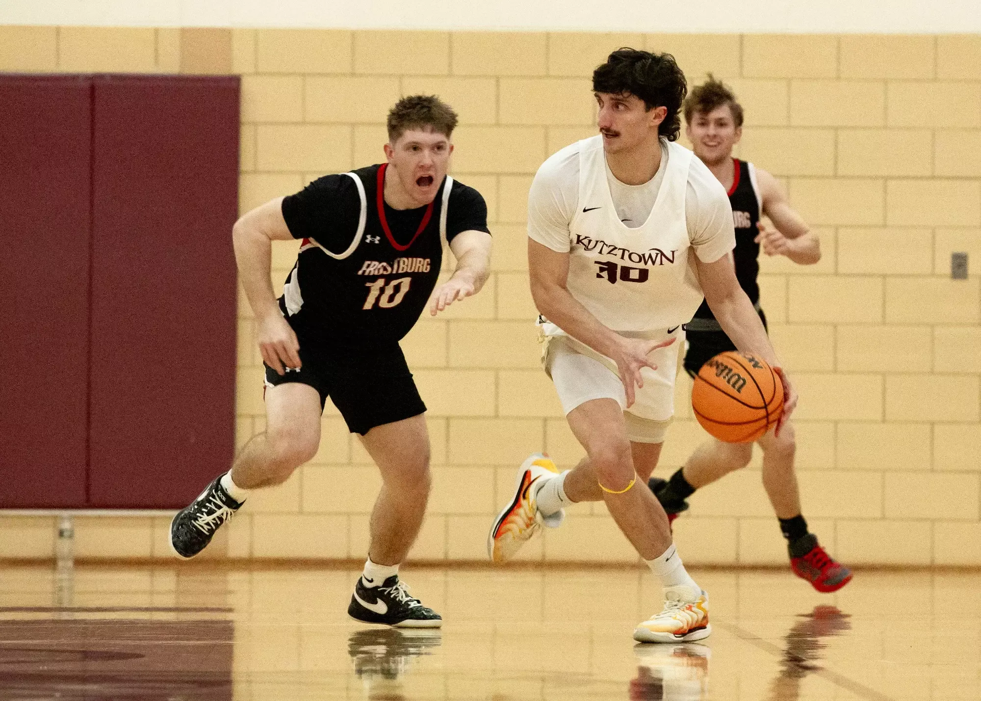 Kidd Brizek battling a defender against Frostburg State 12-1-25