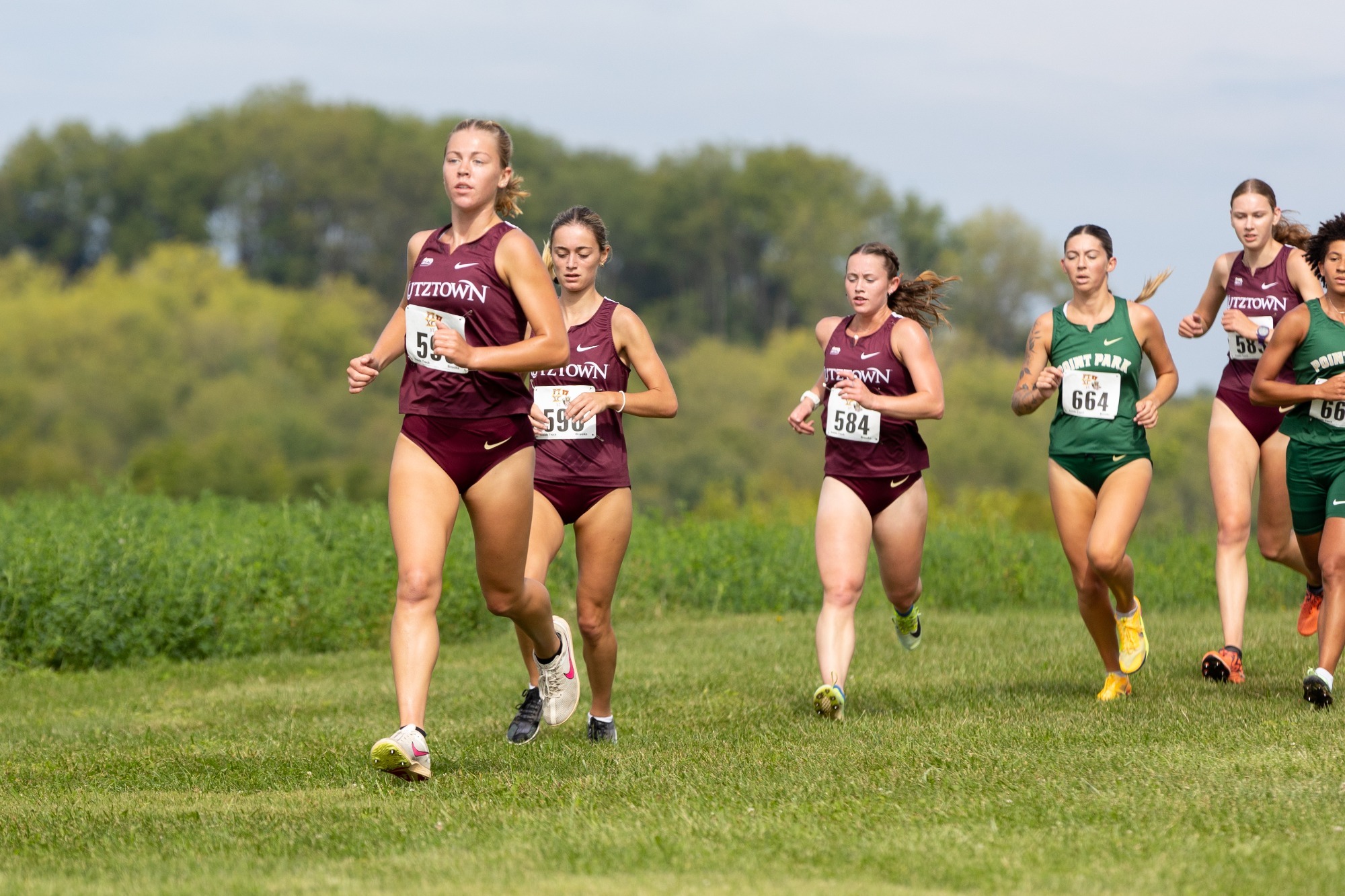 Kutztown women's cross country team running at the Division II/III Challenge, 9/12/26