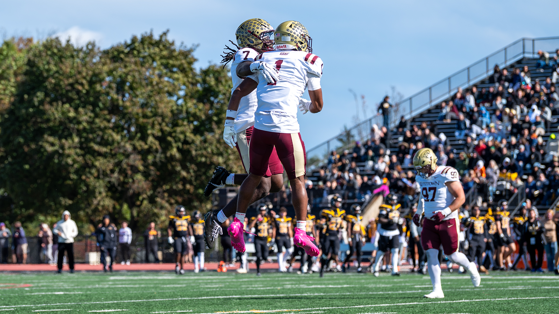 Justin Gonzalez (1) and Mike Fayemi (7) of the Kutztown University football team celebrate following a play in a 45-7 victory at Millersville on Saturday, Oct. 17, 2026.