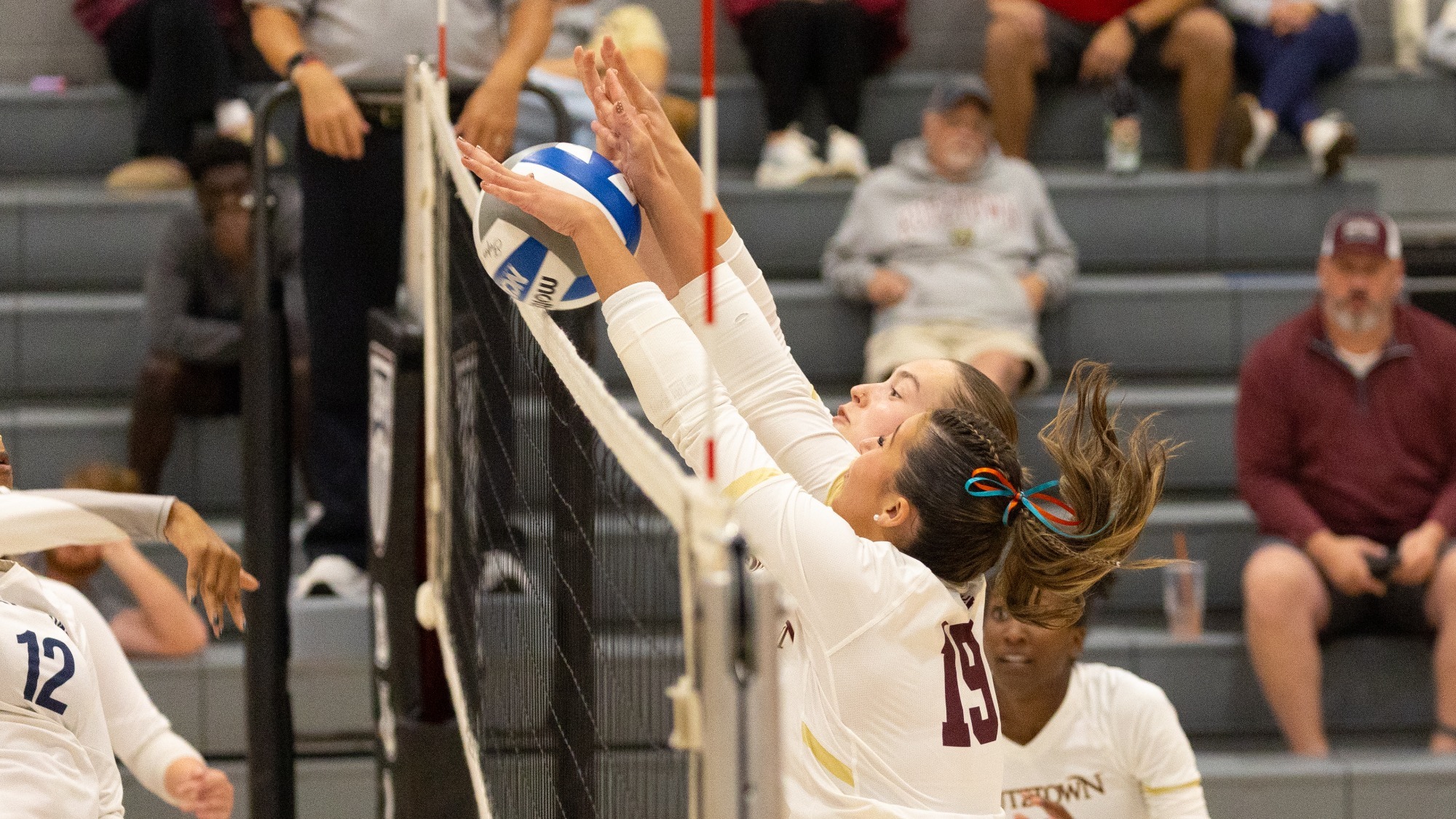 Alex Haskins and Molly Wentz attempting to make a block at the net vs. Lackawanna, 9/22/26