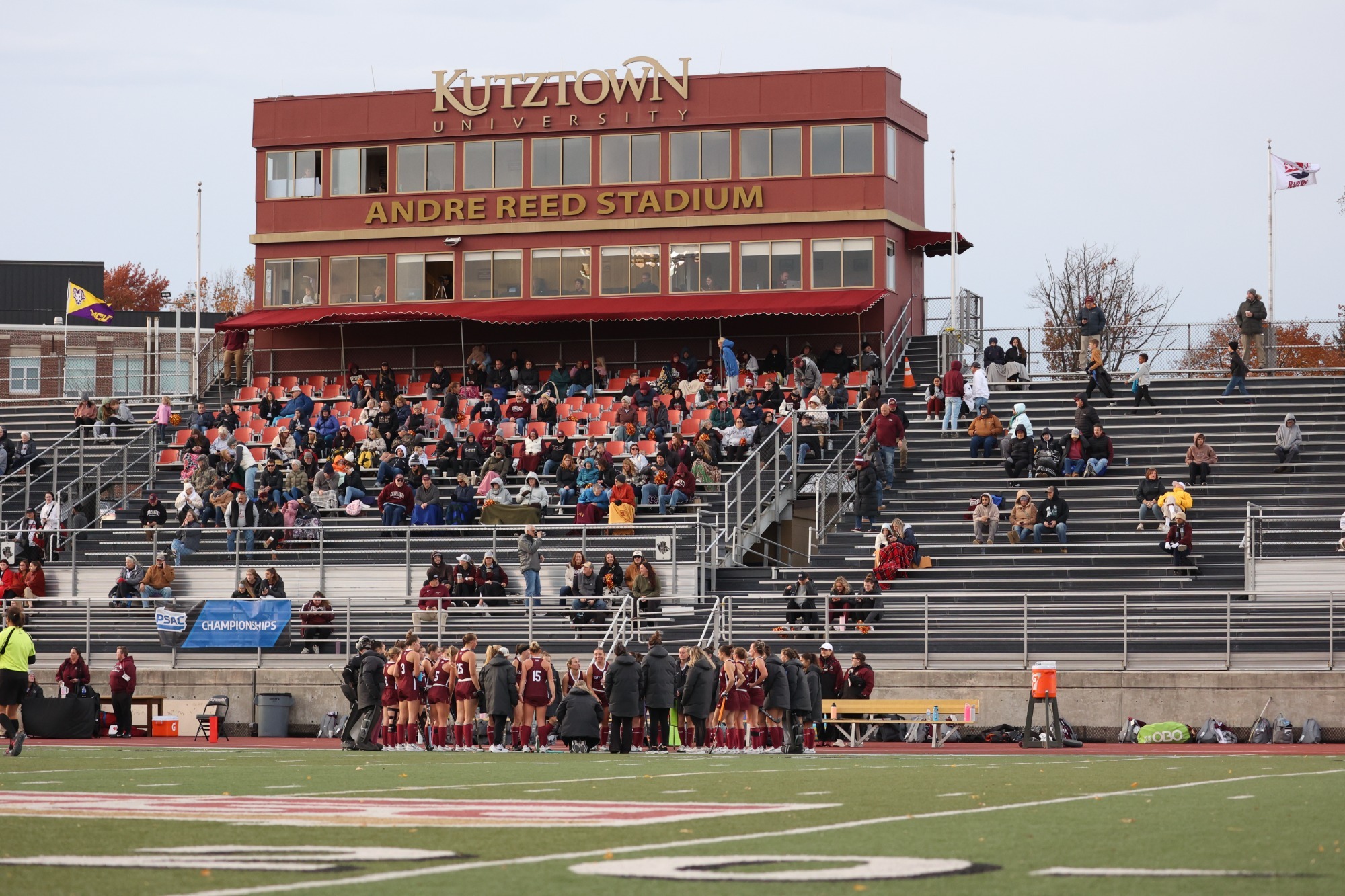 Kutztown field hockey huddled on the sideline vs. West Chester, 11/7/25