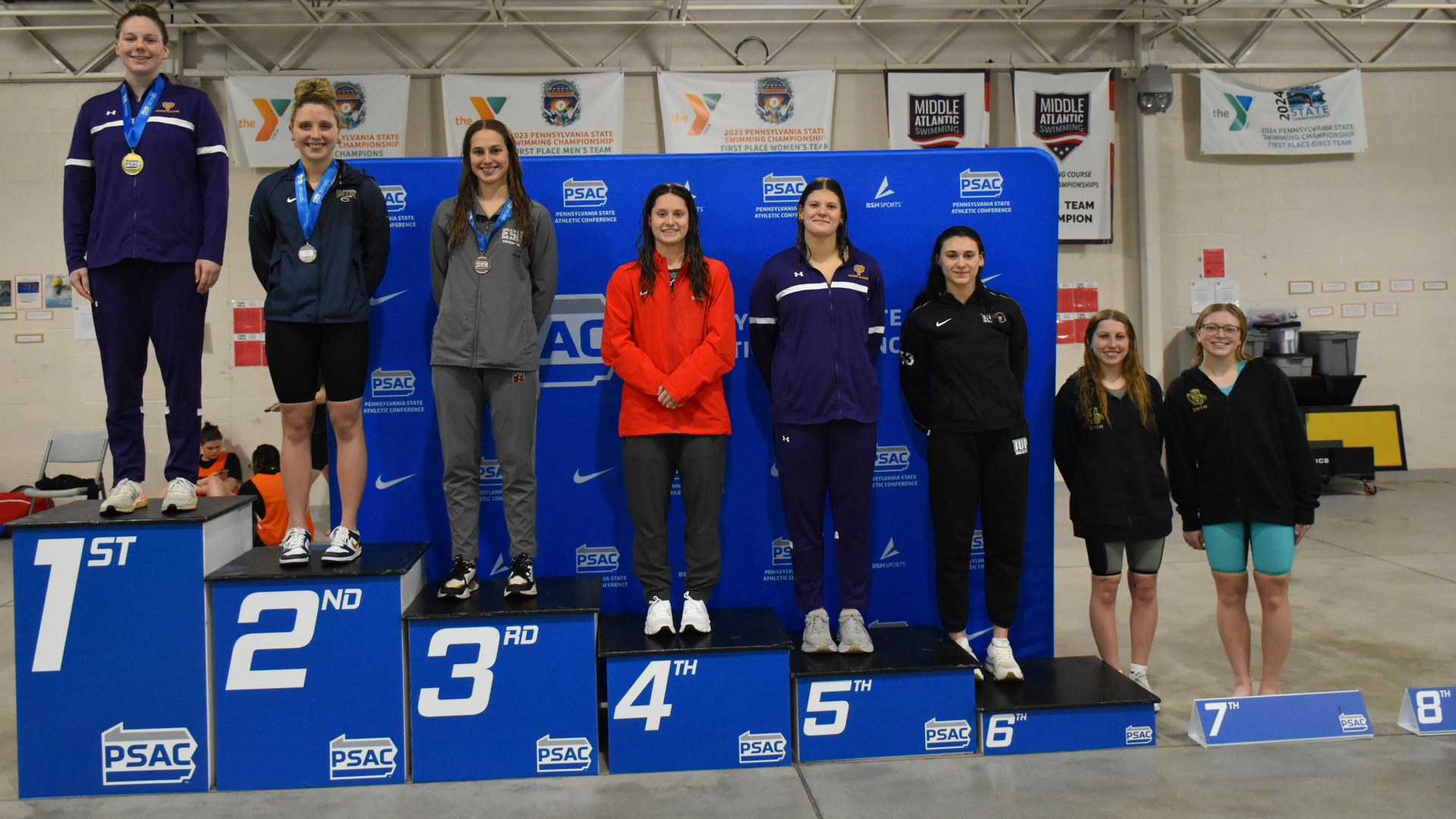 Julia Kopcho and Sarah Zeminski of the Kutztown University women's swim team stand on the podium after finishing seventh and eighth in the 1000-yard freestyle at the PSAC Championships on Wednesday, Feb. 18, 2026.