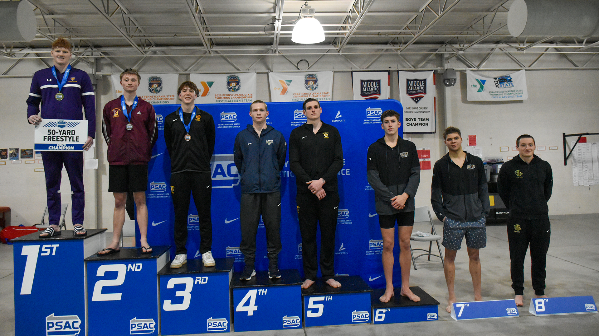 Matheson Bair of the Kutztown University men's swim team appears on the podium after finishing eighth in the 50-yard freestyle at the PSAC Championships on Wednesday, Feb. 18, 2026.