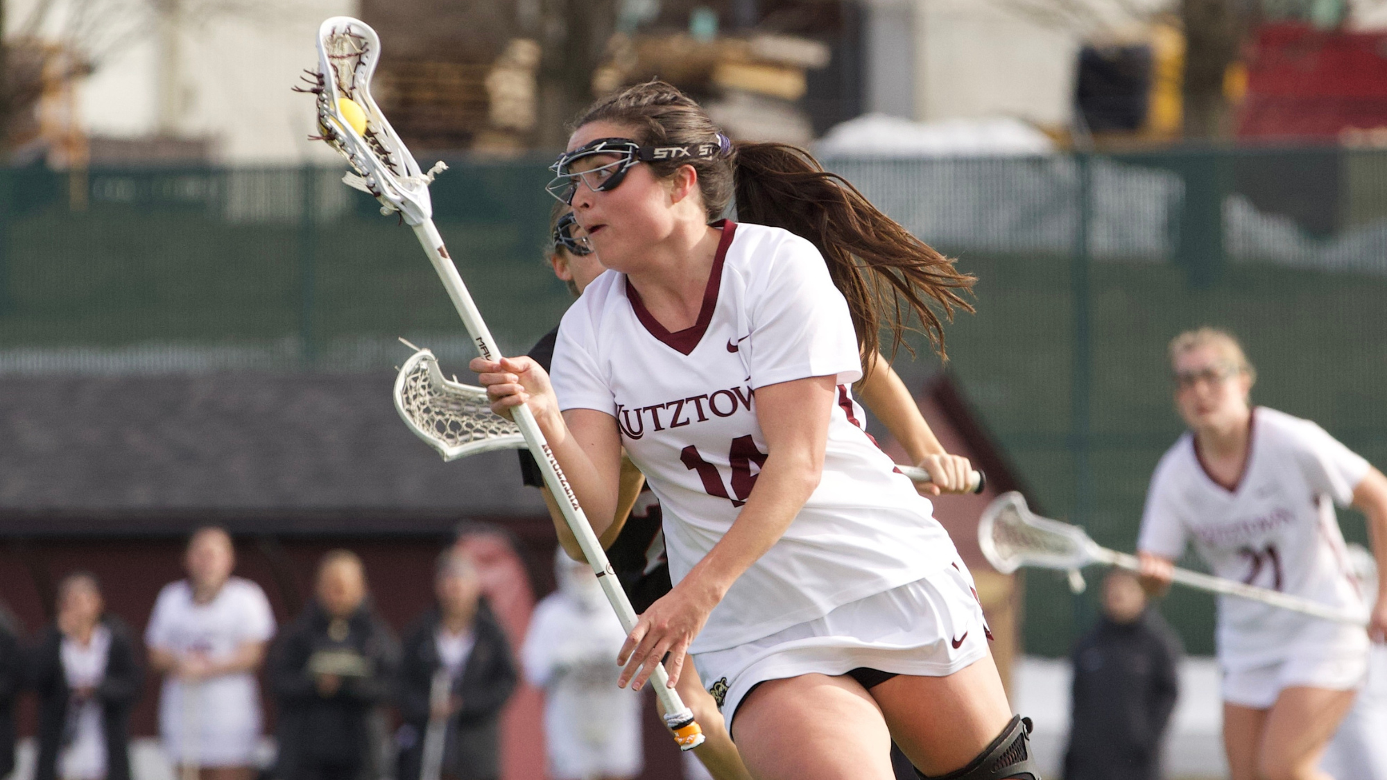 Katie Yocum carries the ball vs. IUP season opener 2.21.26