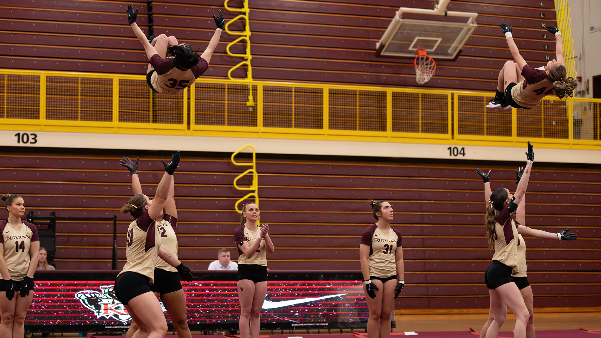 Sienna Barbarisi (35) and Gianna Costanzo (44) of the Kutztown University acrobatics & tumbling team perform dueling flips during a meet against Hawaii Pacific on Tuesday, March 10, 2026.