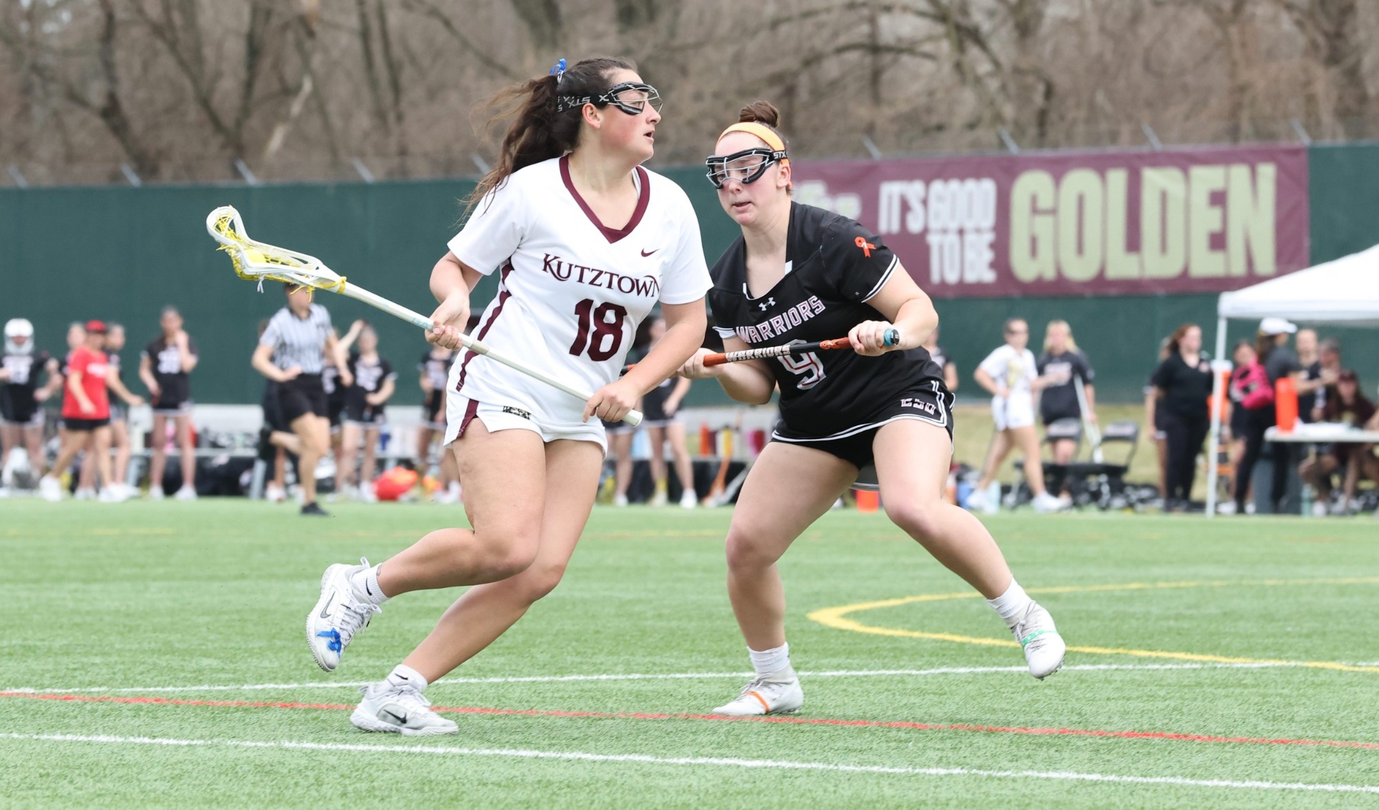 Lauren LaMorte looks to pass ball vs No. 17 ESU, March 11 2026