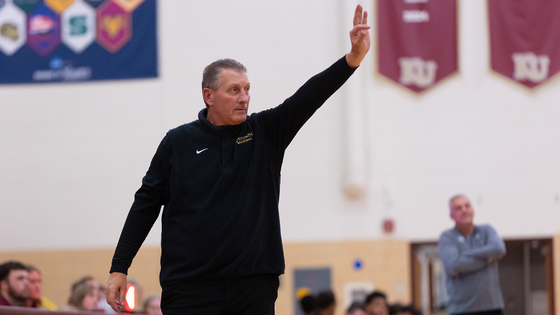 Tom York instructs the Kutztown University men's basketball team to run a play during its game against IUP on Friday, Dec. 5, 2025.
