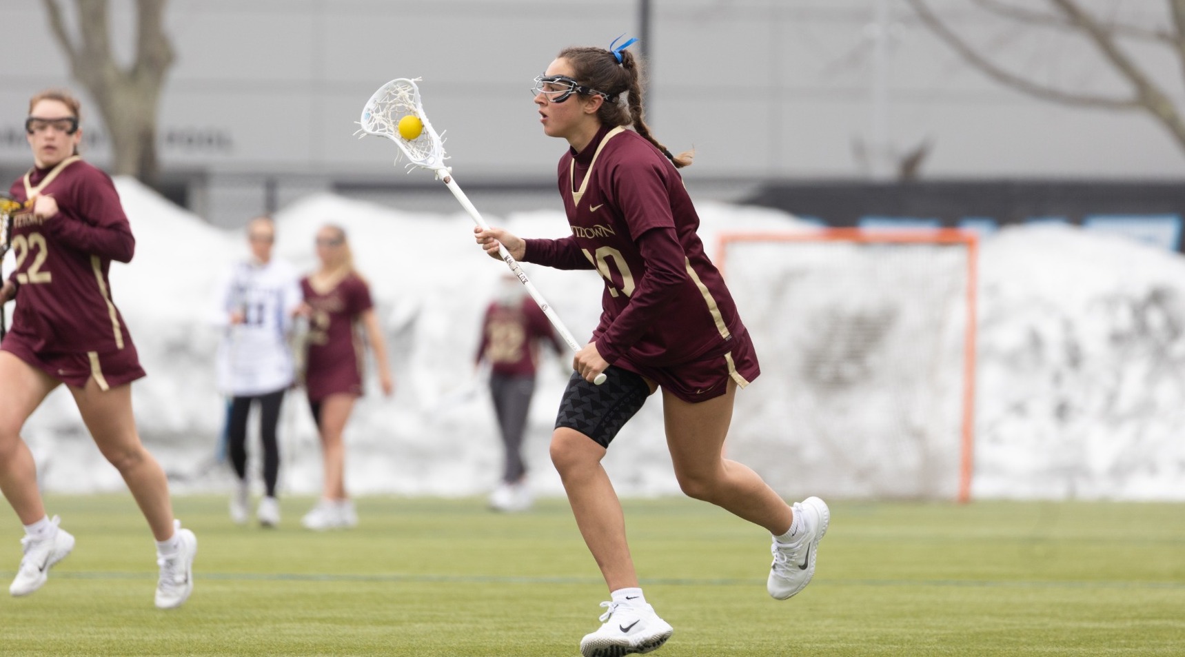 Maddie Wagner carries the ball up the field @ Bentley University