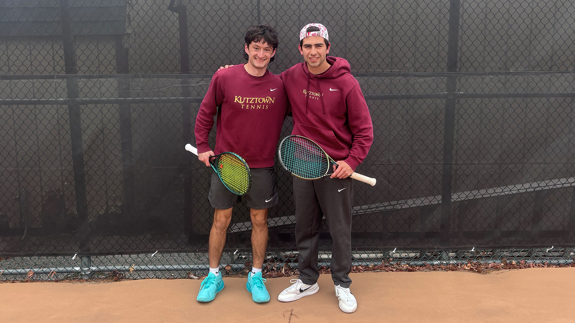Emmitt Robinson and Joaquin Perez of the Kutztown University men's tennis team pose for a photo prior to their Senior Day match against Muhlenberg on Friday, March 27, 2026.