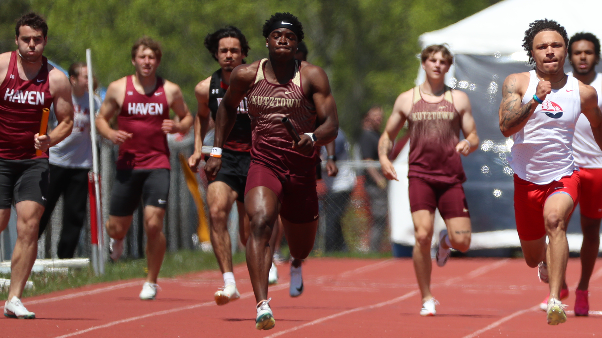 Daron Haggans of the Kutztown University track & field team carries the baton in the 4x100m relay at the 2025 PSAC Outdoor Championships on Saturday, May 10, 2025.
