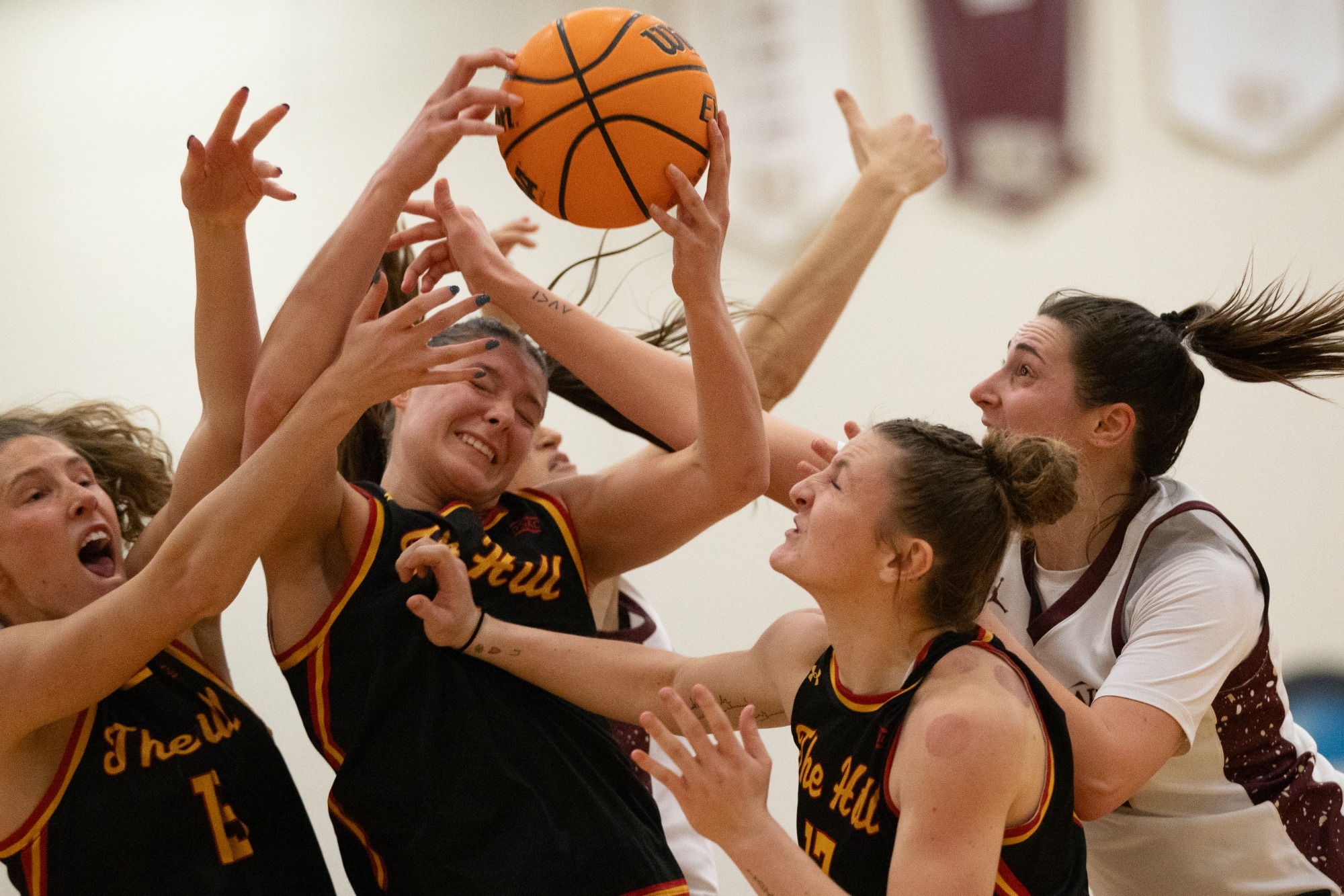 Kutztown and Seton Hill women's basketball fighting for a rebound, 3/4/26