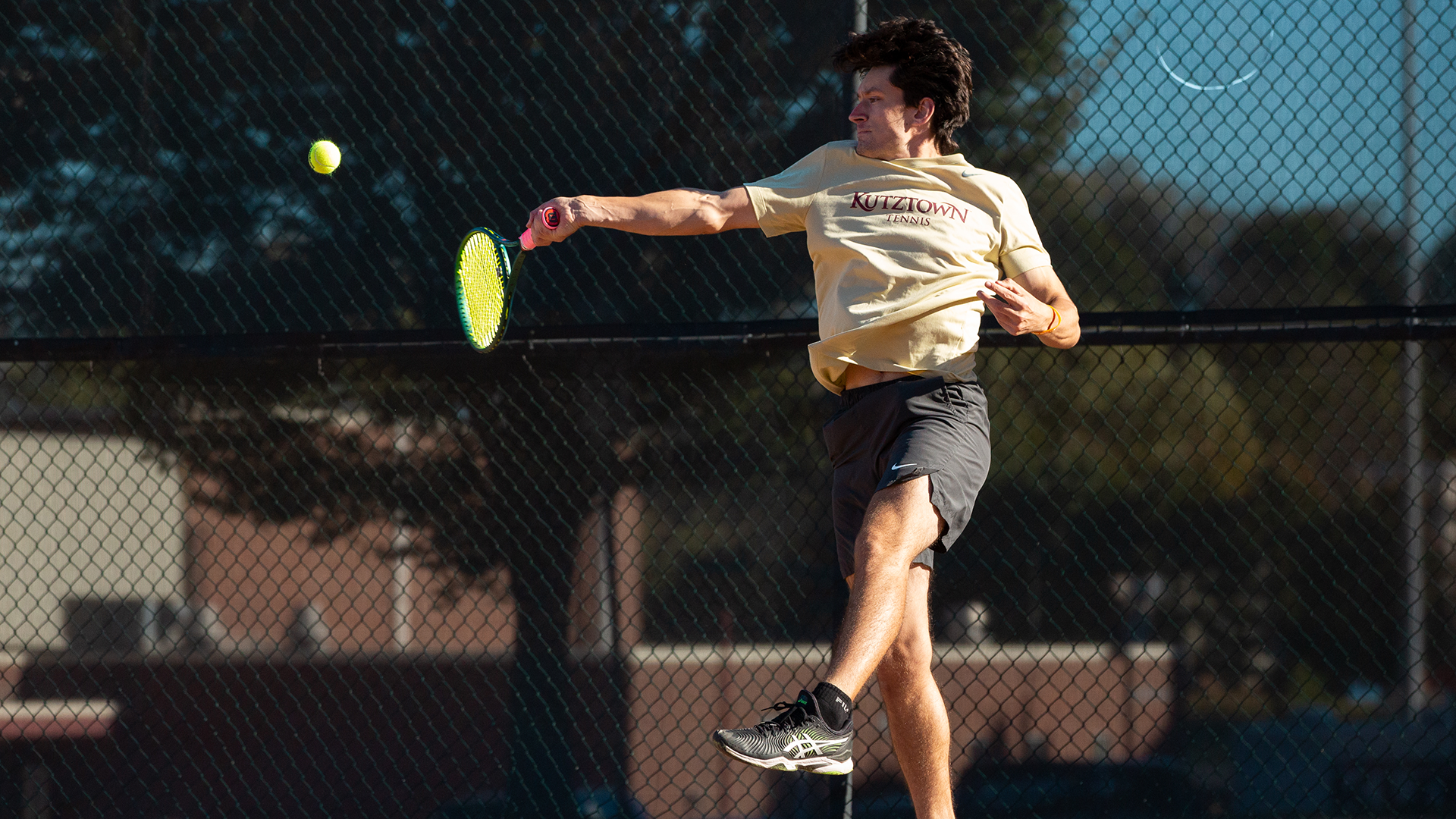 Emmitt Robinson of the Kutztown University men's tennis team hits a forehand shot during a match against Moravian on Oct. 16, 2025.