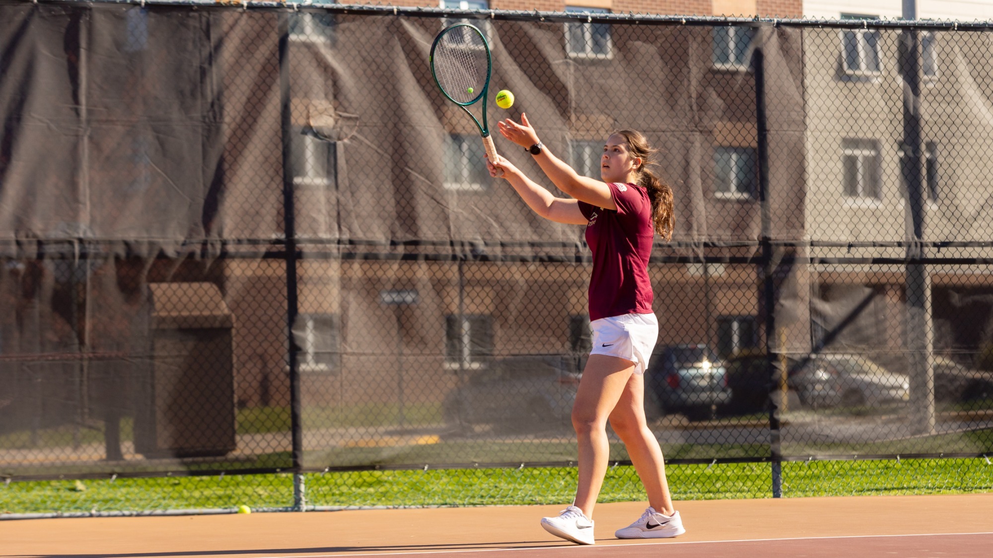 Isabela de Nadai of the Kutztown University women's tennis team serves during a PSAC East match against East Stroudsburg April 8, 2026.