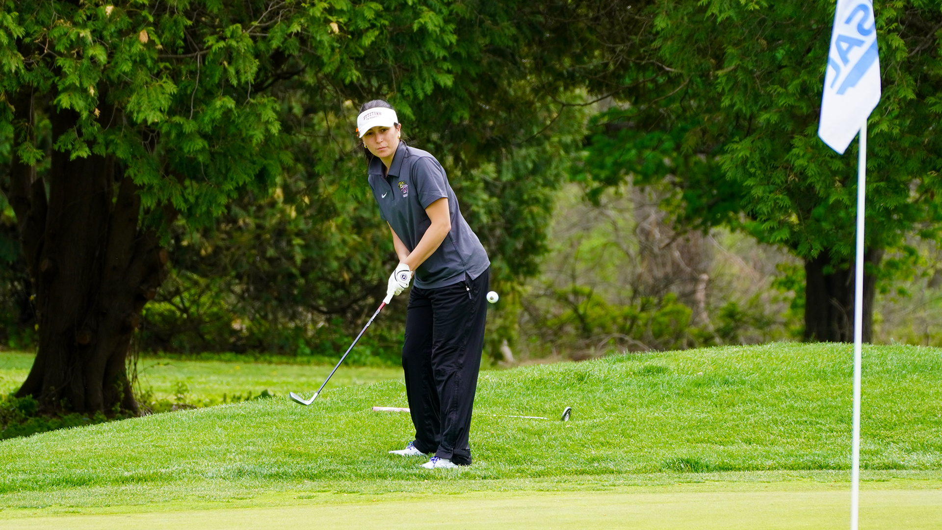 Gabby Cohen of the Kutztown University women's golf team chips during the first round of the PSAC Championship at Berkleigh Golf Club on Wednesday, April 22, 2026.