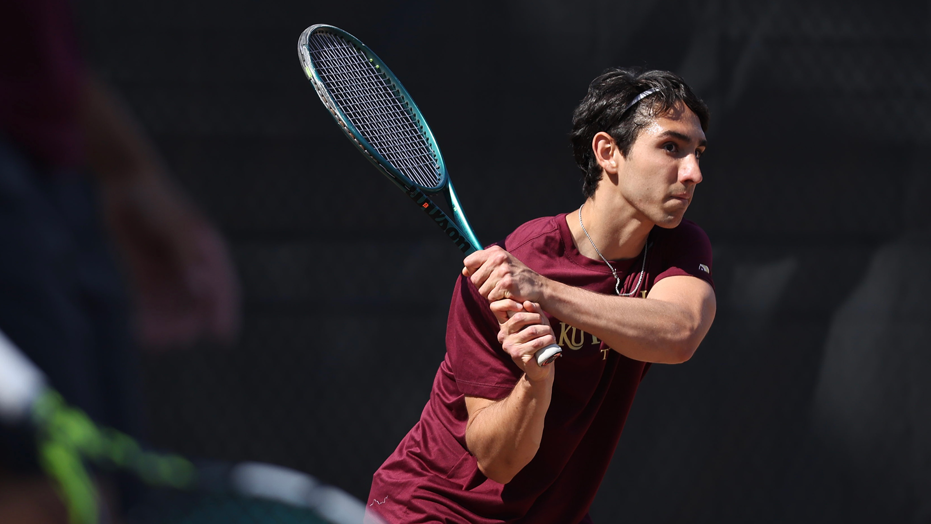 Henrique Rocha of the Kutztown University men's tennis team follows through on a shot during a match against Chestnut Hill on Thursday, April 23, 2026.