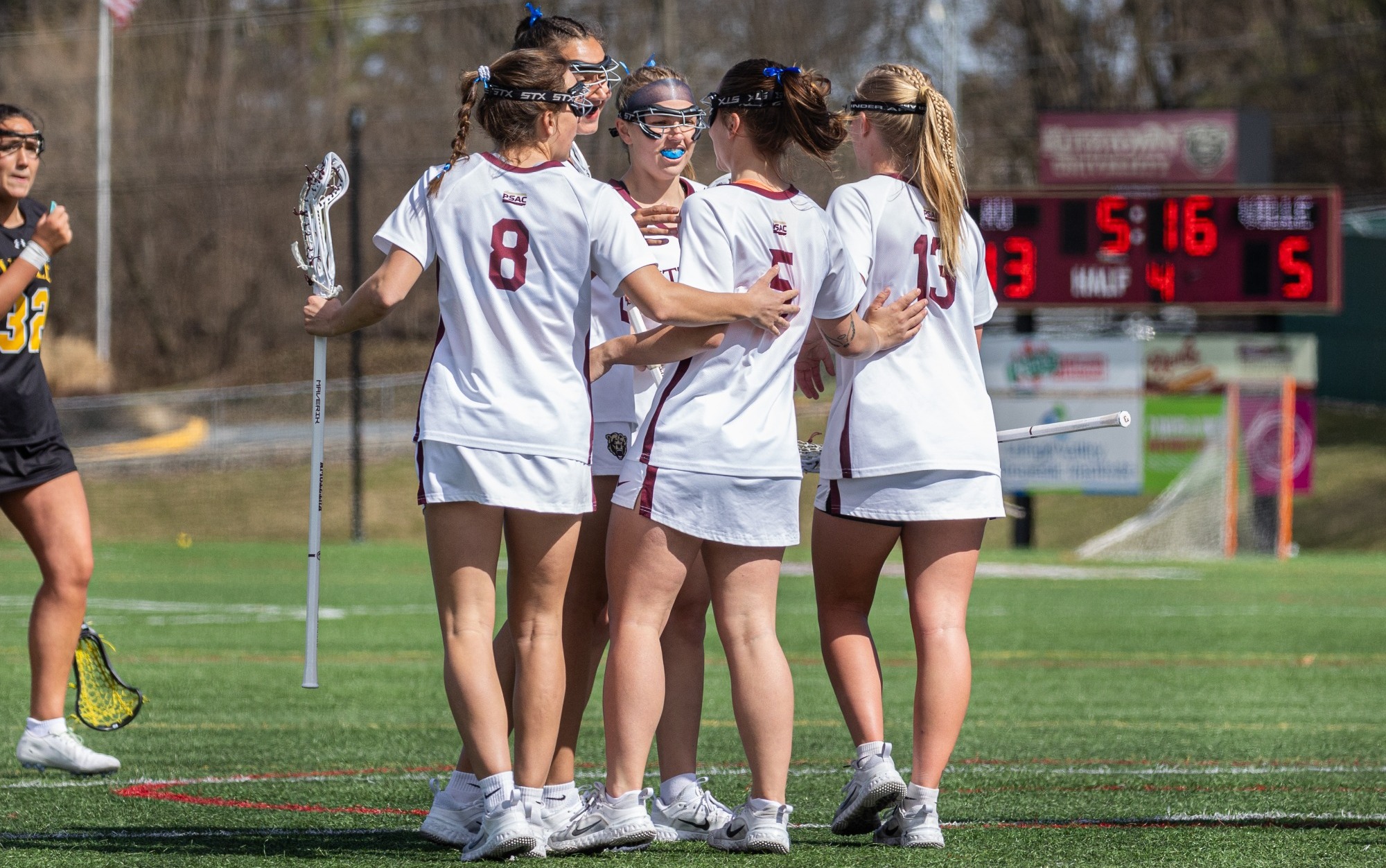 Kutztown Women's Lacrosse Teams celebrates a Sophie Engelhardt goal