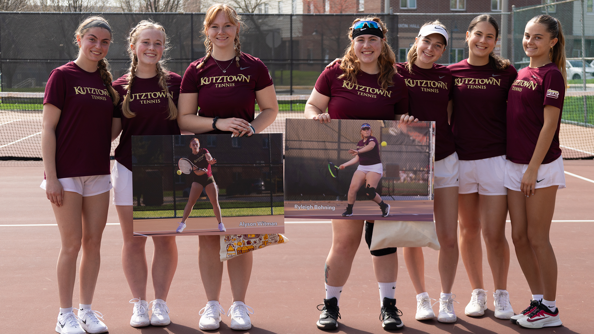 Kutztown University women's tennis honored seniors Alyson Witman and Ryleigh Bohning prior to its match against Goldey-Beacom Saturday, April 4, 2026. In this photo, Witman and Bohning pose with their Golden Bear teammates.