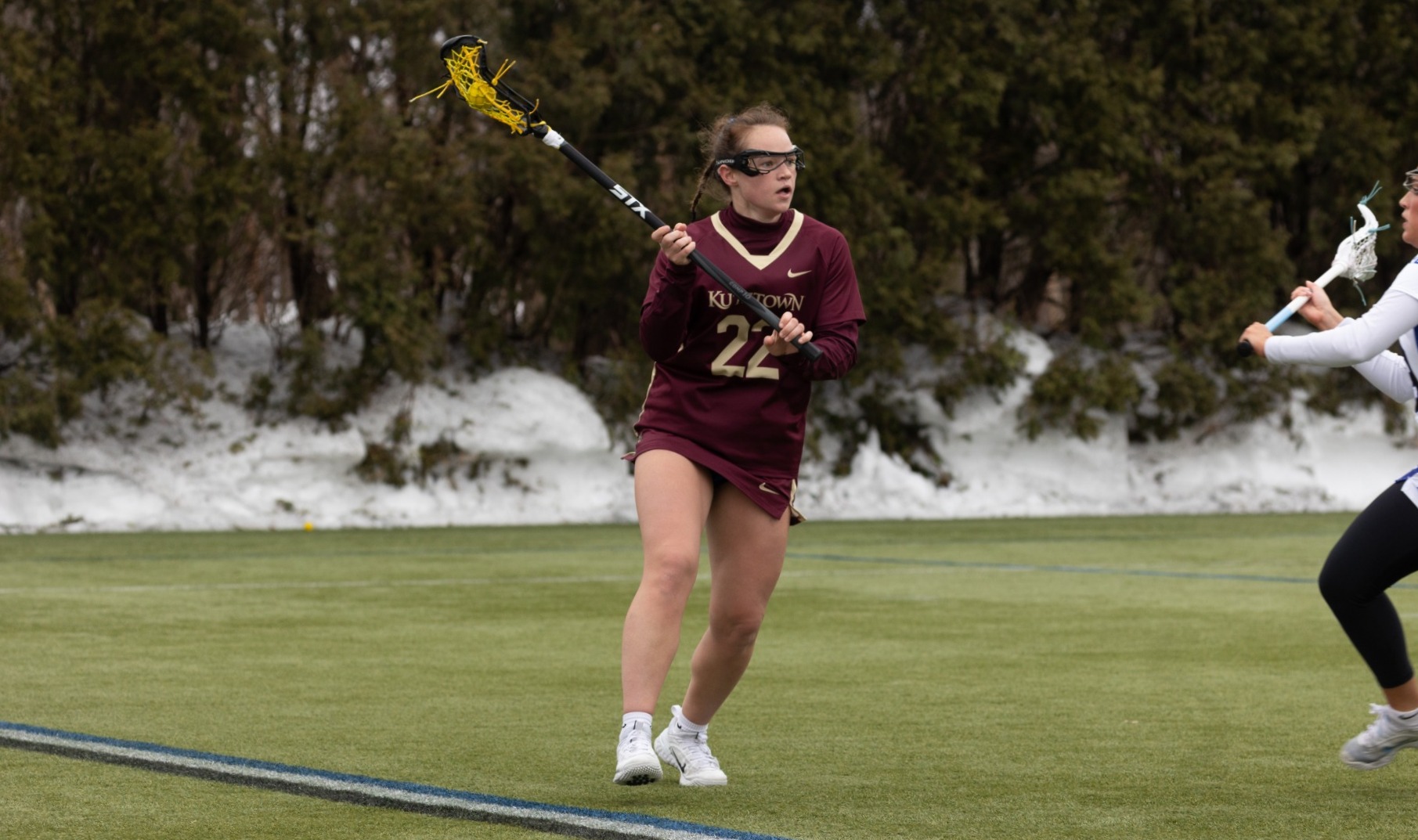 Madison Wenner dodges a Bentley student-athlete at Bentley during 2026 spring break trip