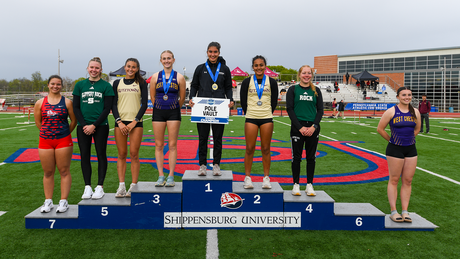 Natalie Holland (sixth from left) and Taylor Funk (third from left) stand on the podium following their top eight finishes in the pole vault at the 2026 PSAC Outdoor Track & Field Championships on Friday, May 1, 2026.