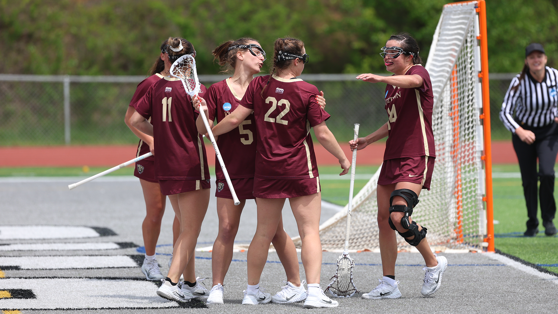 Kutztown women's lacrosse celebrating a goal vs. Slippery Rock, 5/9/26