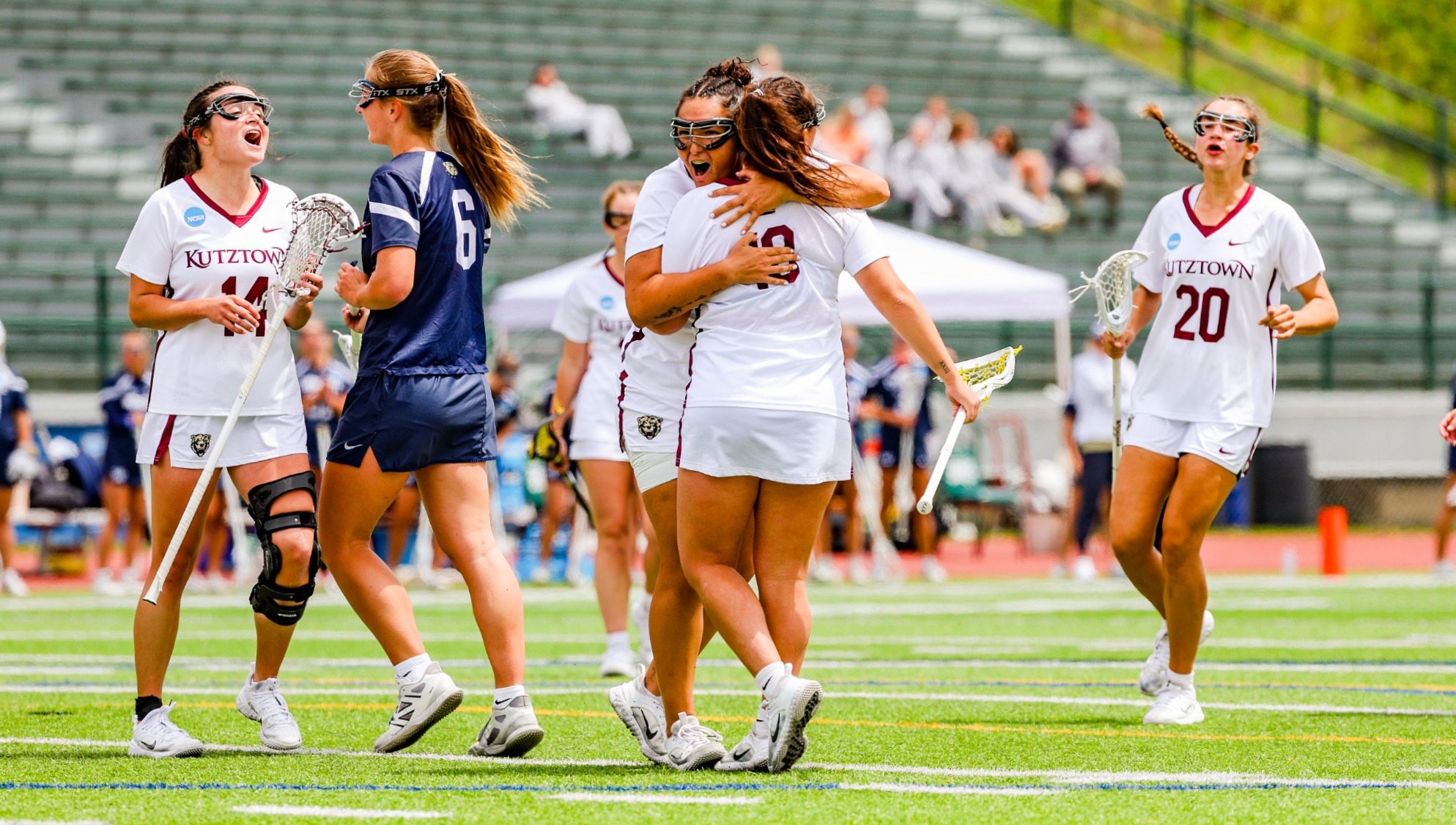 Isabella Montouri hugs Lauren LaMorte after a goal vs. Wingate 5.7.26
