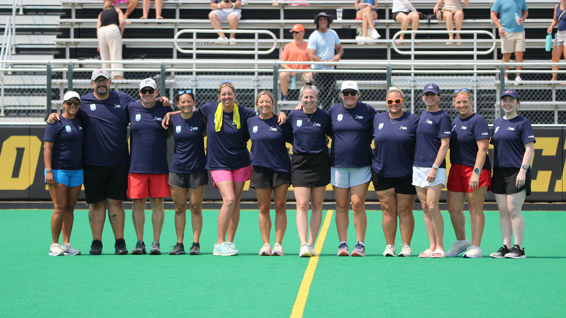 Kutztown University head field hockey coach Marci Scheuing (sixth from left) poses with other coaches at the 2026 U18 AAU Junior Olympics.
