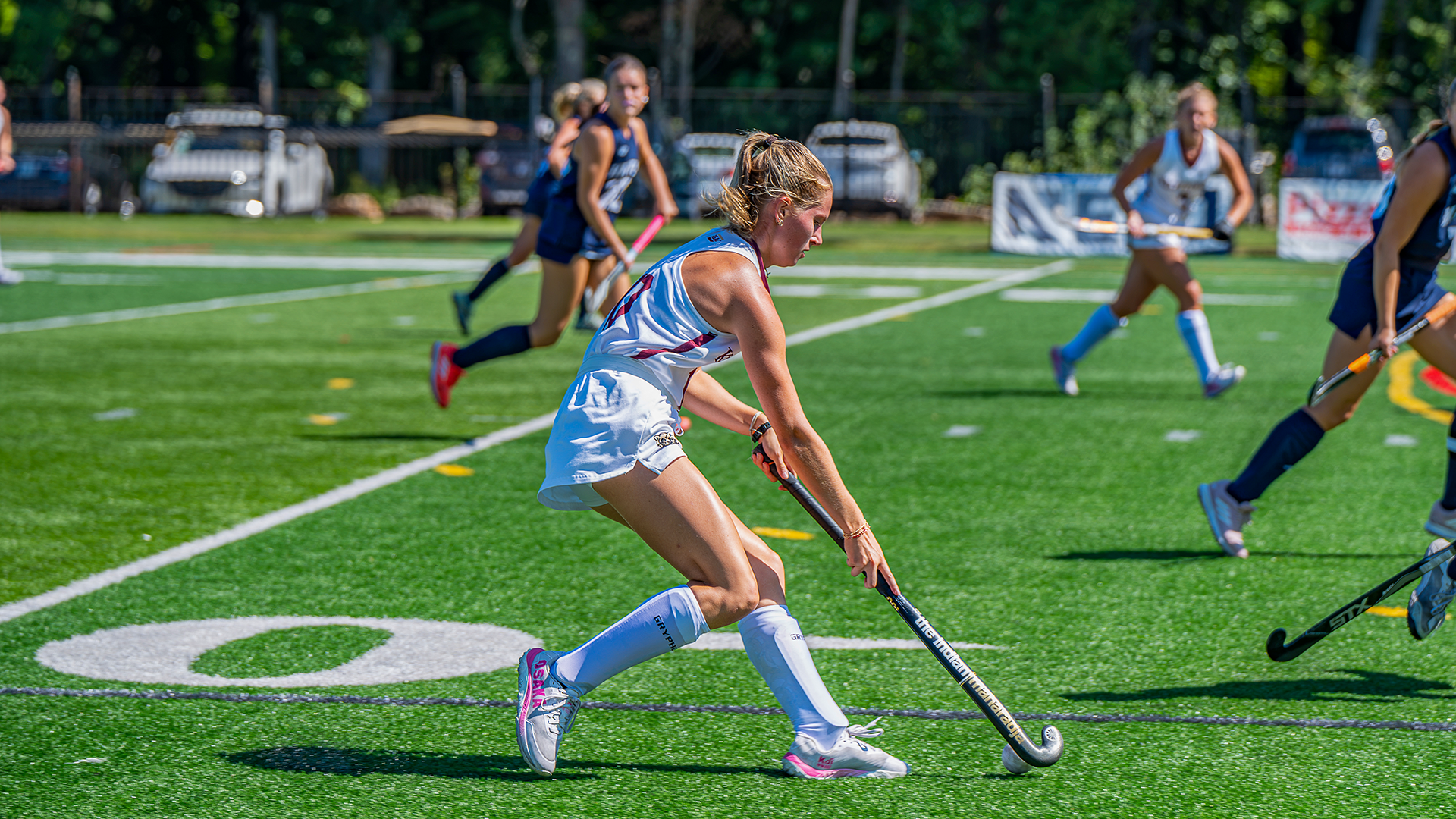 Anna Harris of the Kutztown University field hockey team carries the ball in her team's 2-1 victory over No. 7 Saint Anselm on Saturday, Sept. 12, 2026.
