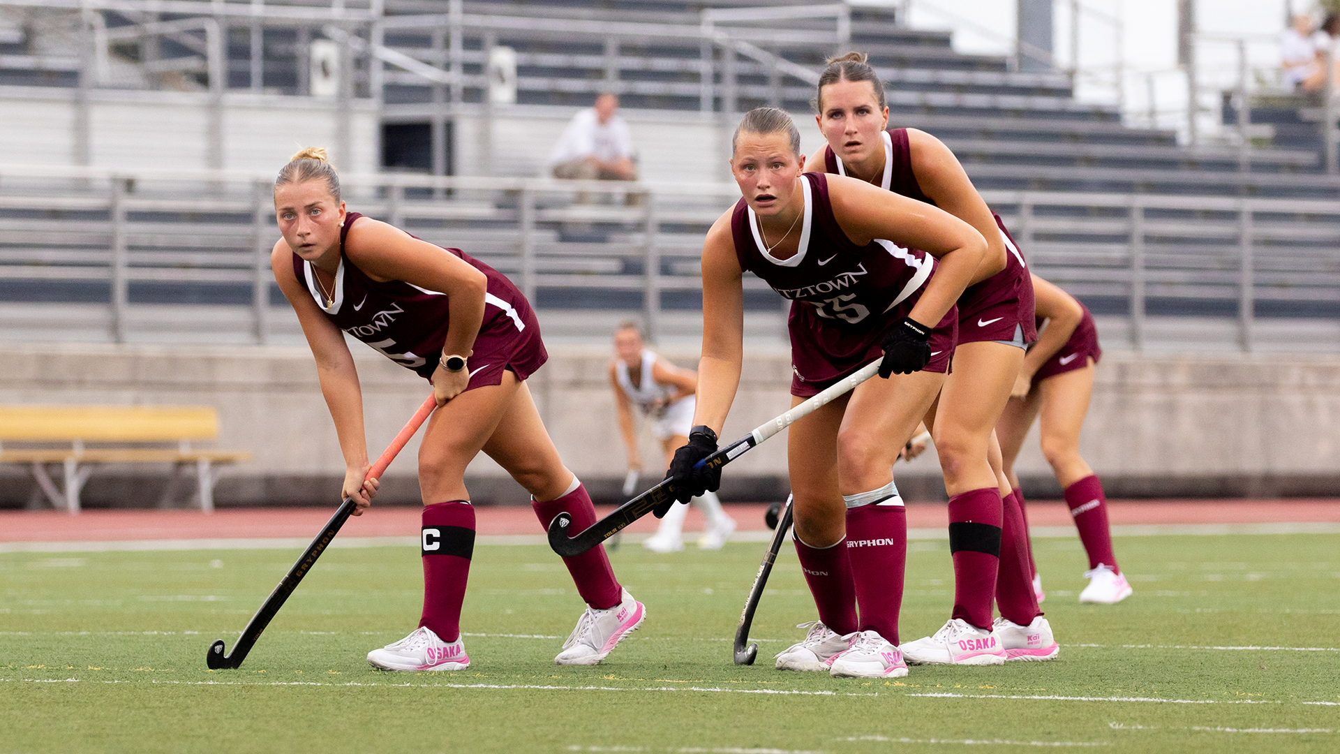 Kutztown Field Hockey's Marissa Rice, Olivia Kirkpatrick, and Marlee Fetrow wait for the ball to be inserted in its matchup against Shippensburg on 9/17/26